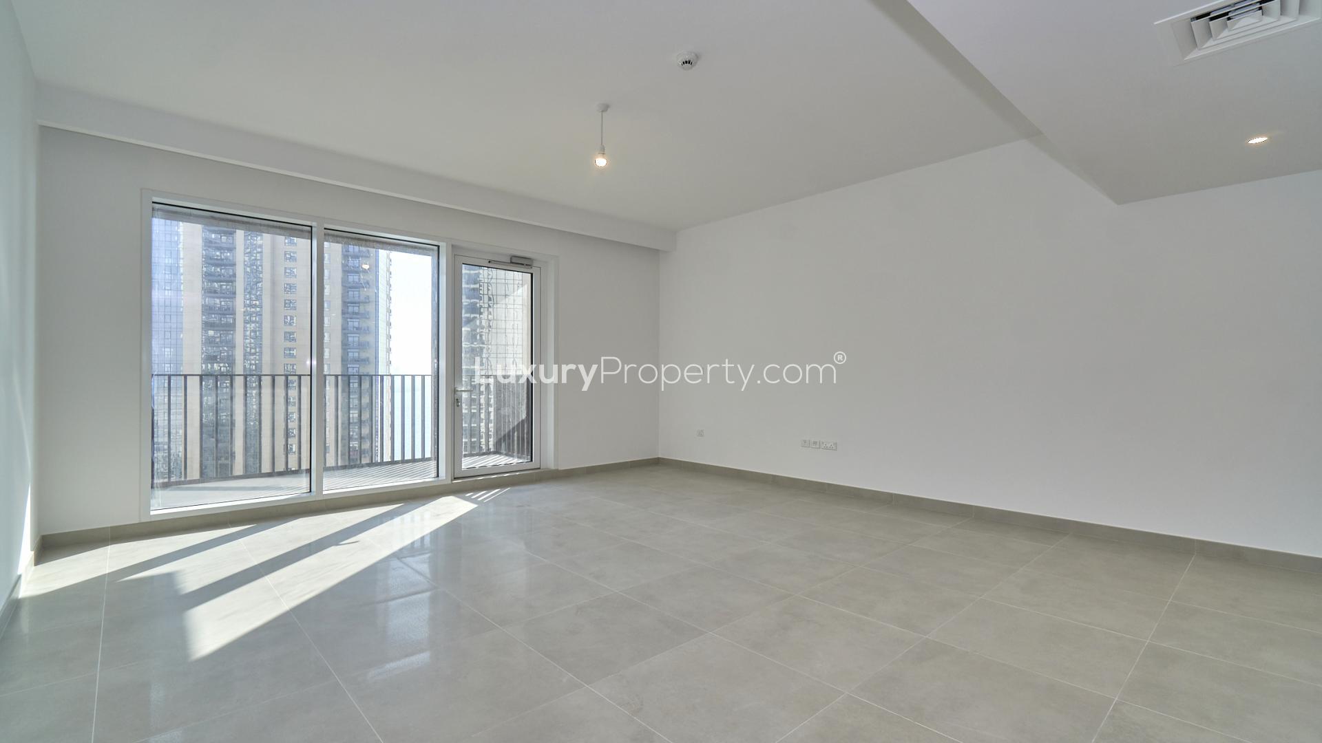 Bright living area in creek-facing apartment, Creek Horizon, with city view windows