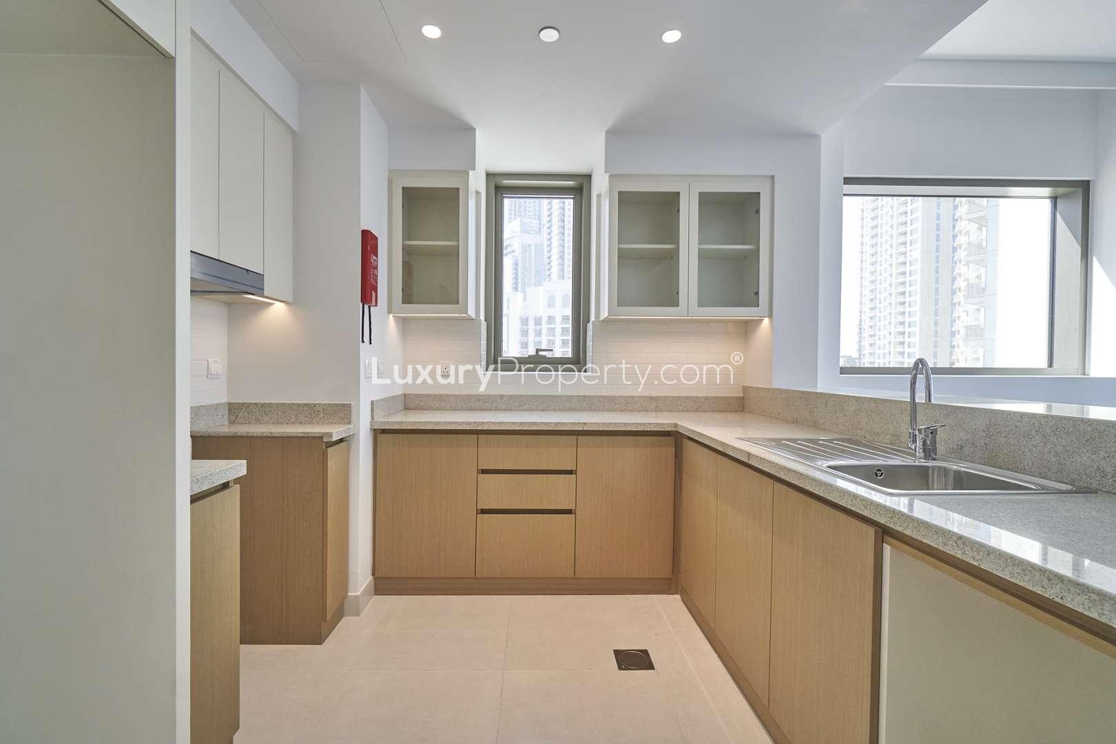 Modern kitchen and living area in Creekside 18 apartment, Dubai Creek Harbour