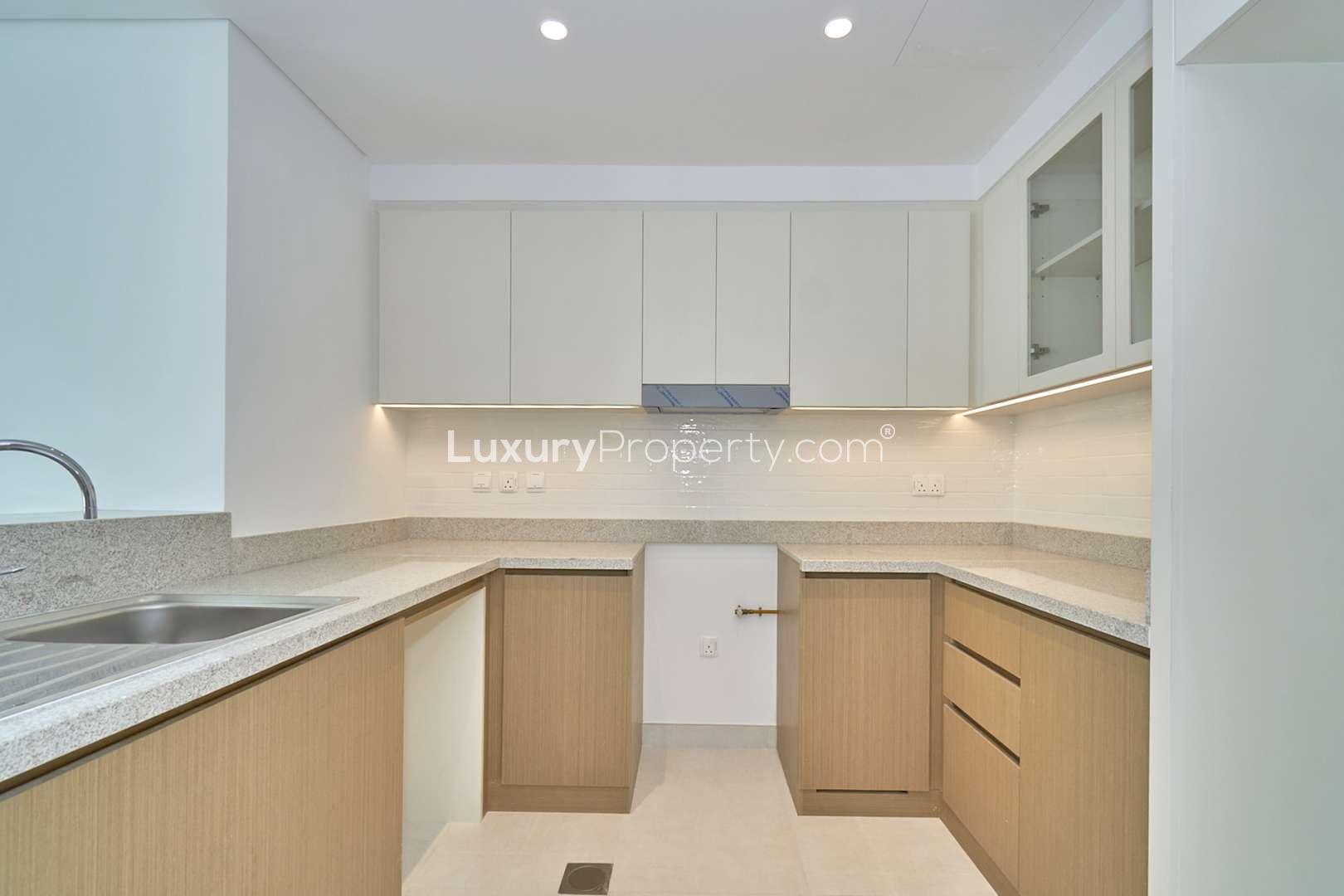 Empty living room with large windows in Creekside 18 apartment, Dubai Creek Harbour