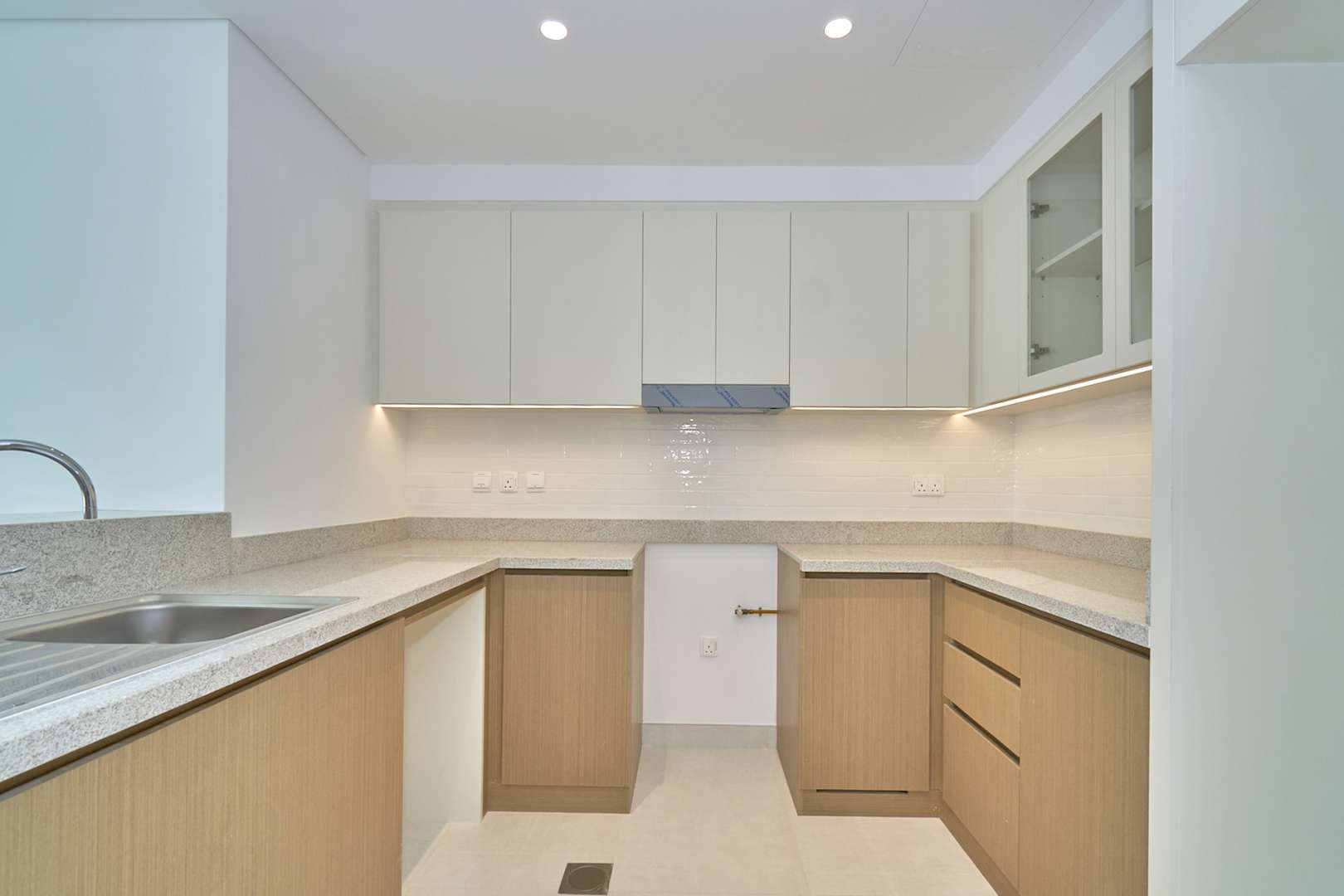 Empty living room with large windows in Creekside 18 apartment, Dubai Creek Harbour