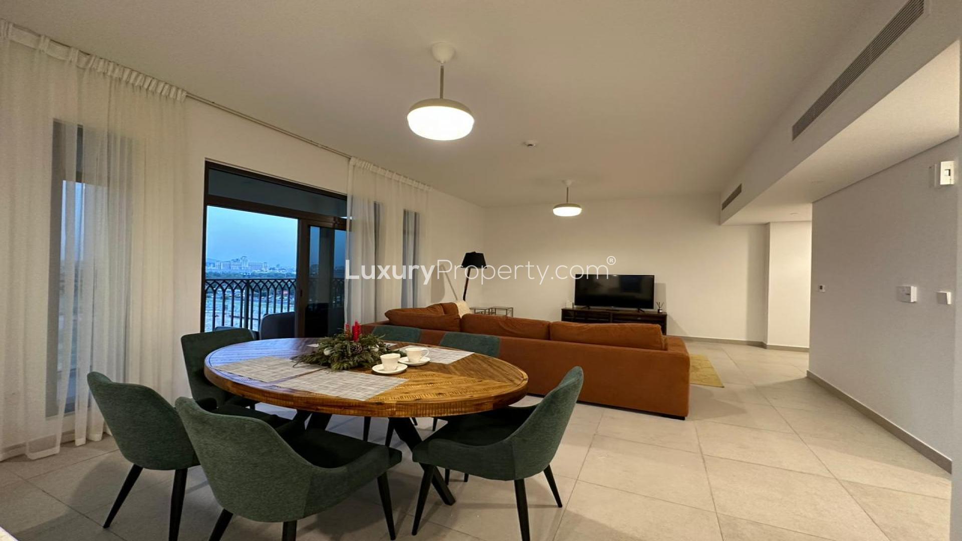 Modern living room in 2-bedroom apartment, Umm Suqeim 3, with open kitchen and cozy decor