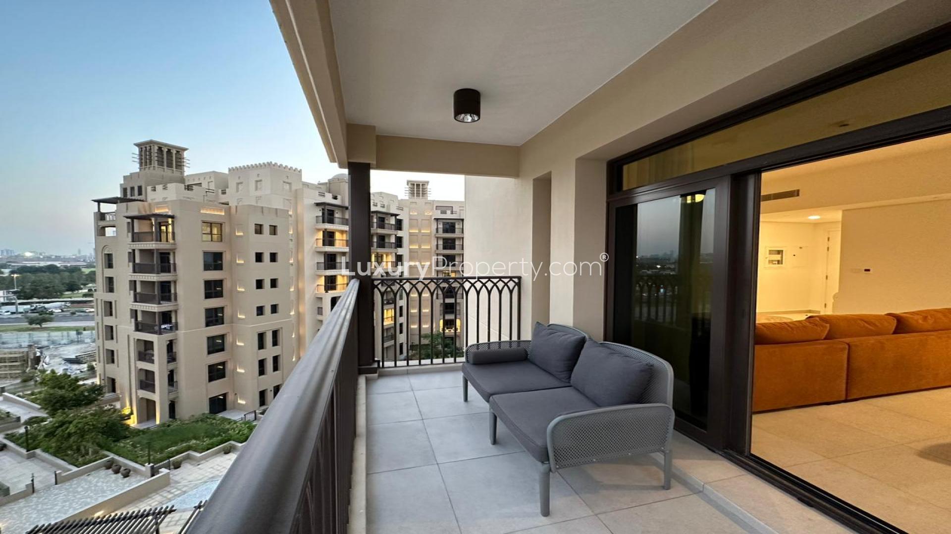 Lavish living room in 2-bedroom apartment, Umm Suqeim 3, with modern furnishings and balcony view