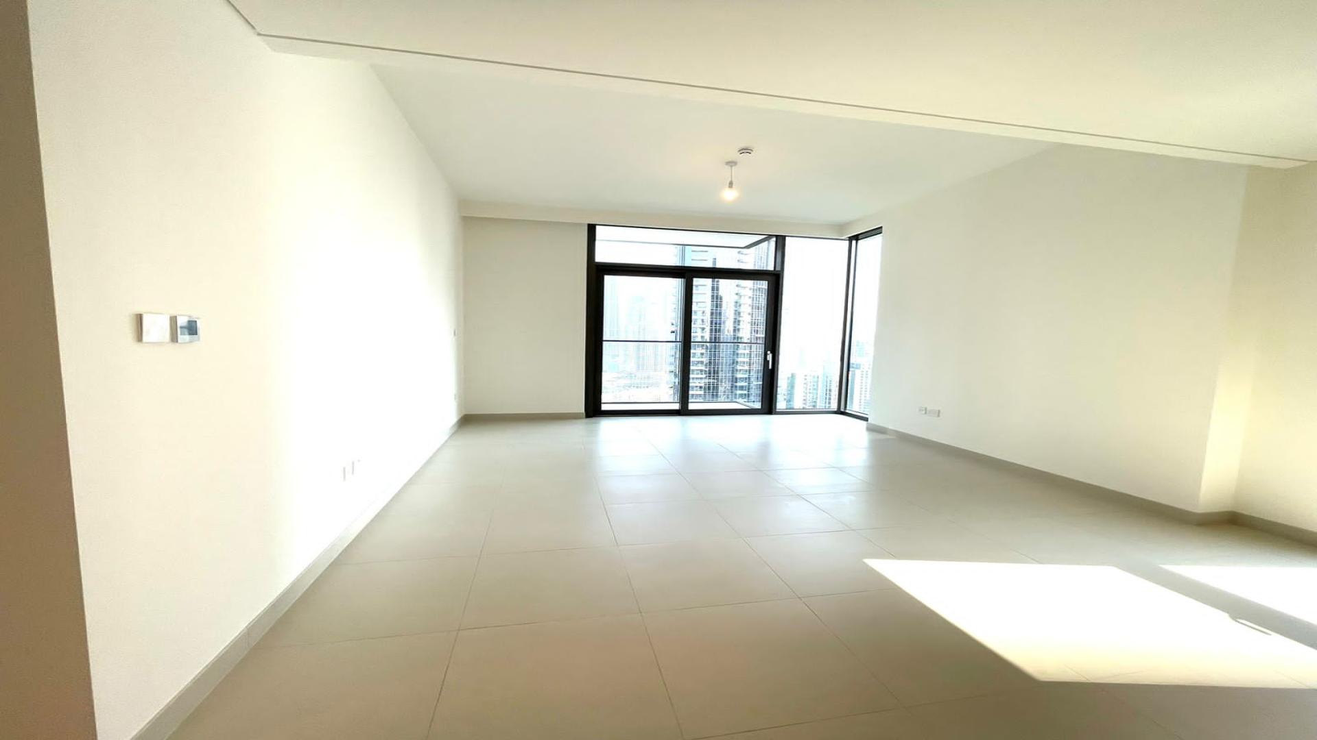 Modern kitchen and living area in Burj Crown apartment, Downtown Dubai for rent