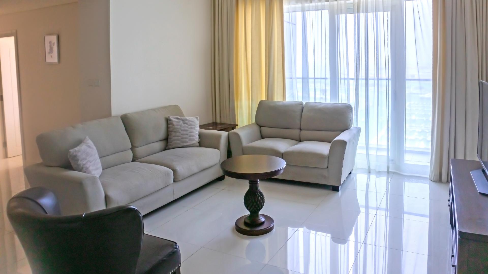 Fully furnished living room in Damac Heights apartment, Dubai Marina, with sea view