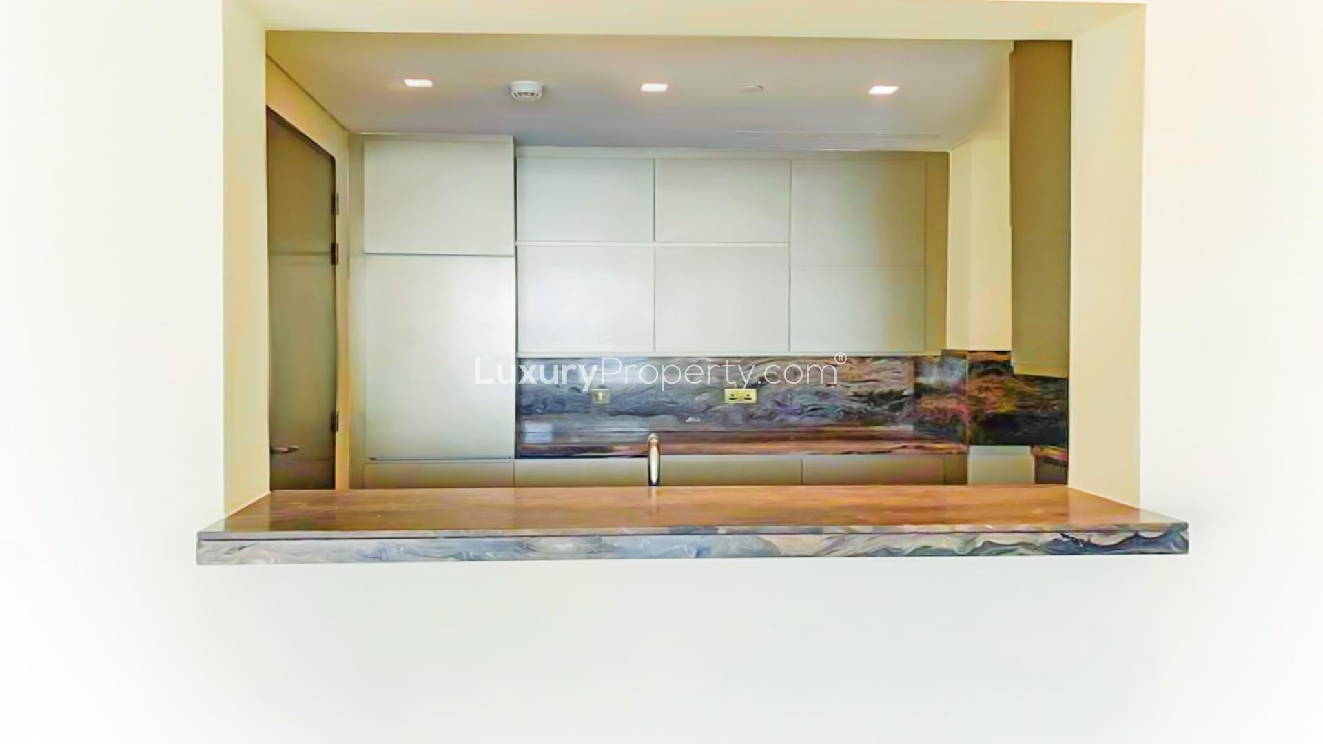 "Spacious living area with sea view in luxury Dubai Marina apartment for rent.",Modern kitchen in luxury apartment, Damac Heights, Dubai Marina, available for rent