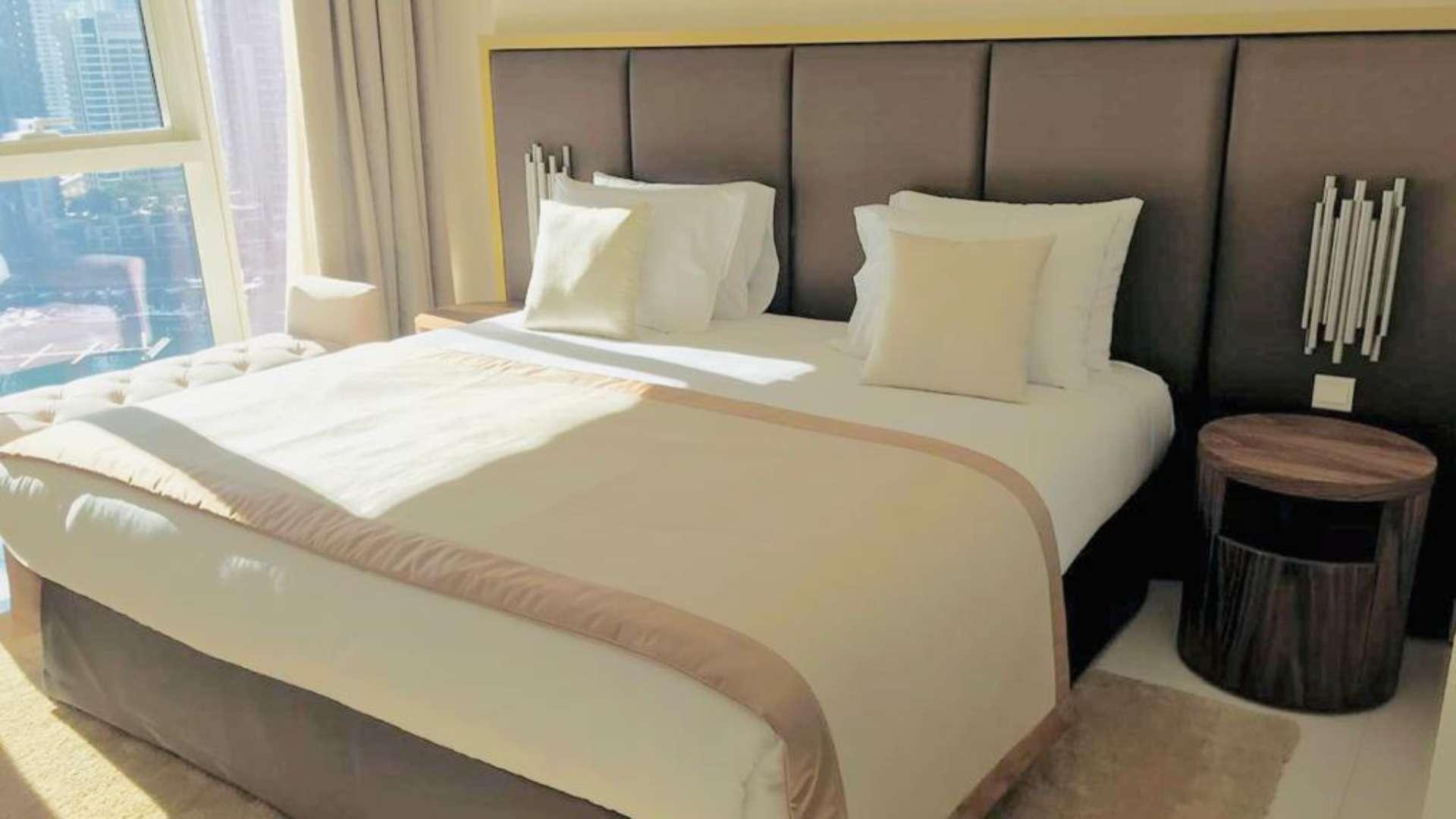 Fully furnished living room in upgraded Dubai Marina apartment, Damac Heights, with marina views