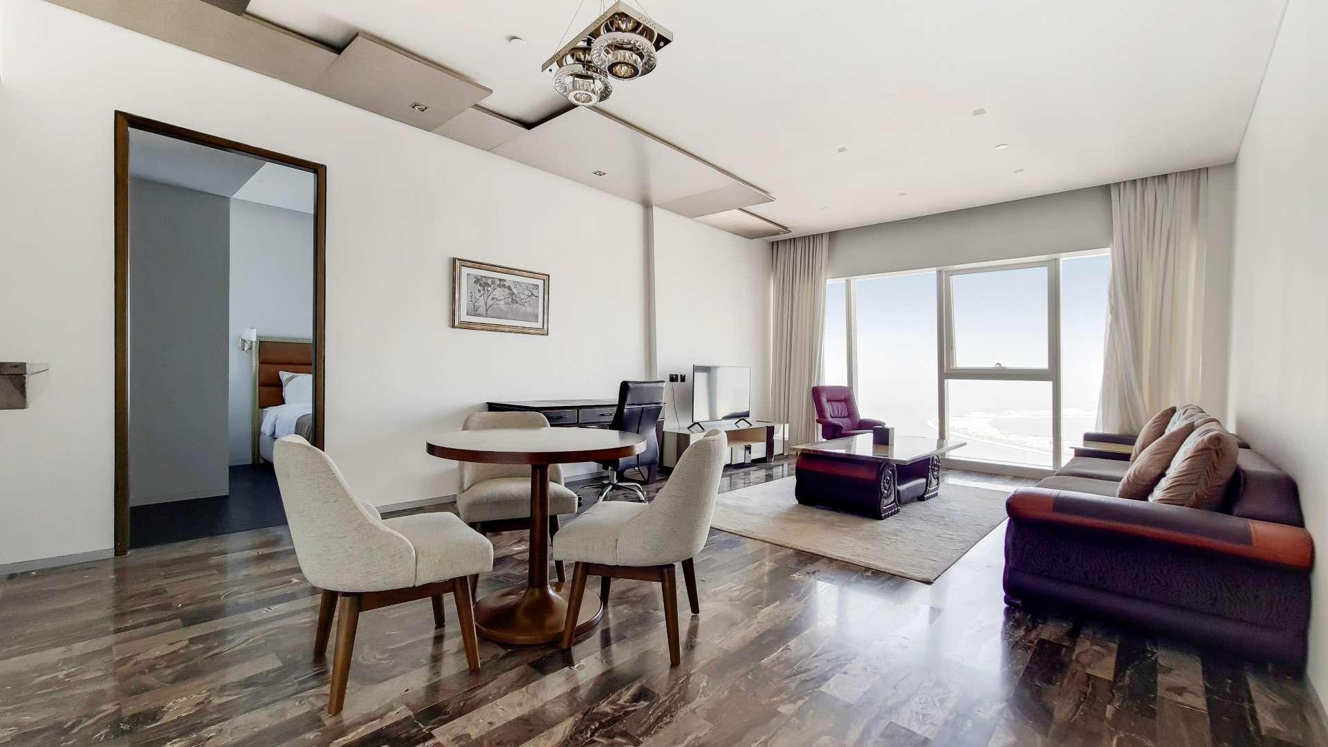 Furnished living room in high-floor Damac Heights apartment, Dubai Marina, with modern decor