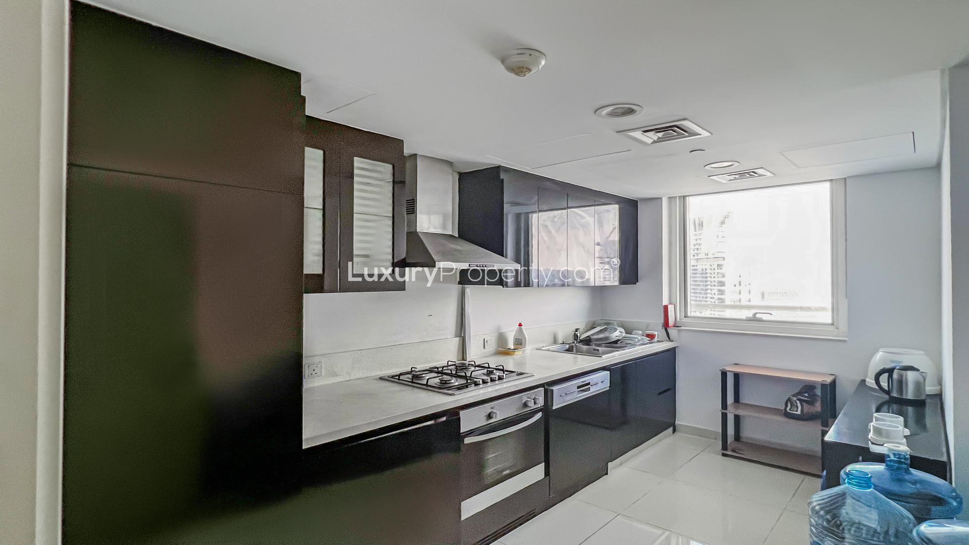 Modern kitchen and dining area in Business Bay apartment, DAMAC Maison Canal Views