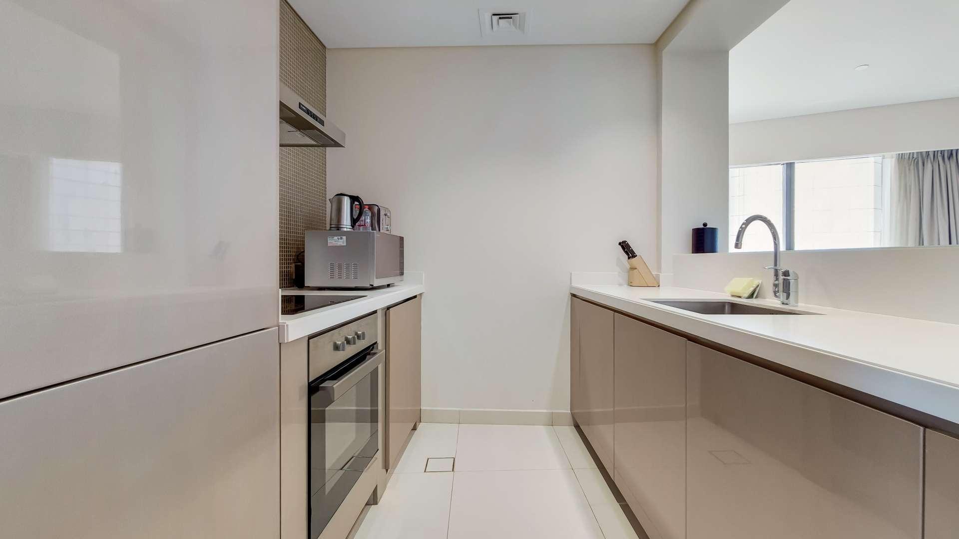 Modern dining area in two-bedroom apartment, Business Bay, DAMAC Towers by Paramount