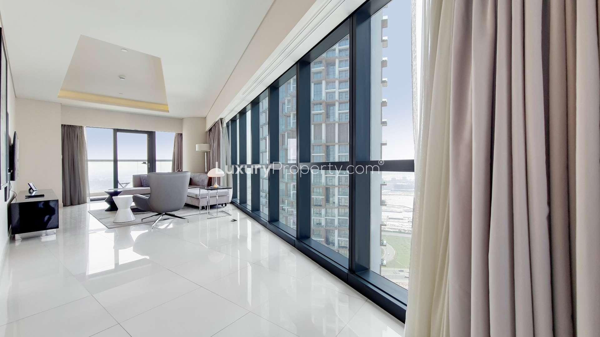 Modern living room and dining area in two-bedroom apartment, Business Bay, Dubai Canal view