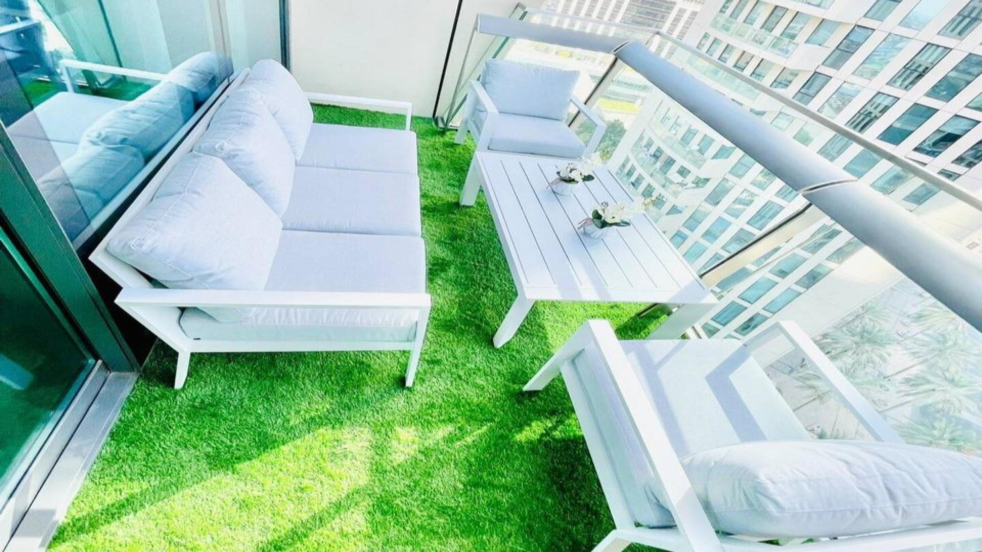 Modern kitchen in furnished 2-bed apartment, Burj Vista, Downtown Dubai, featuring sleek cabinetry