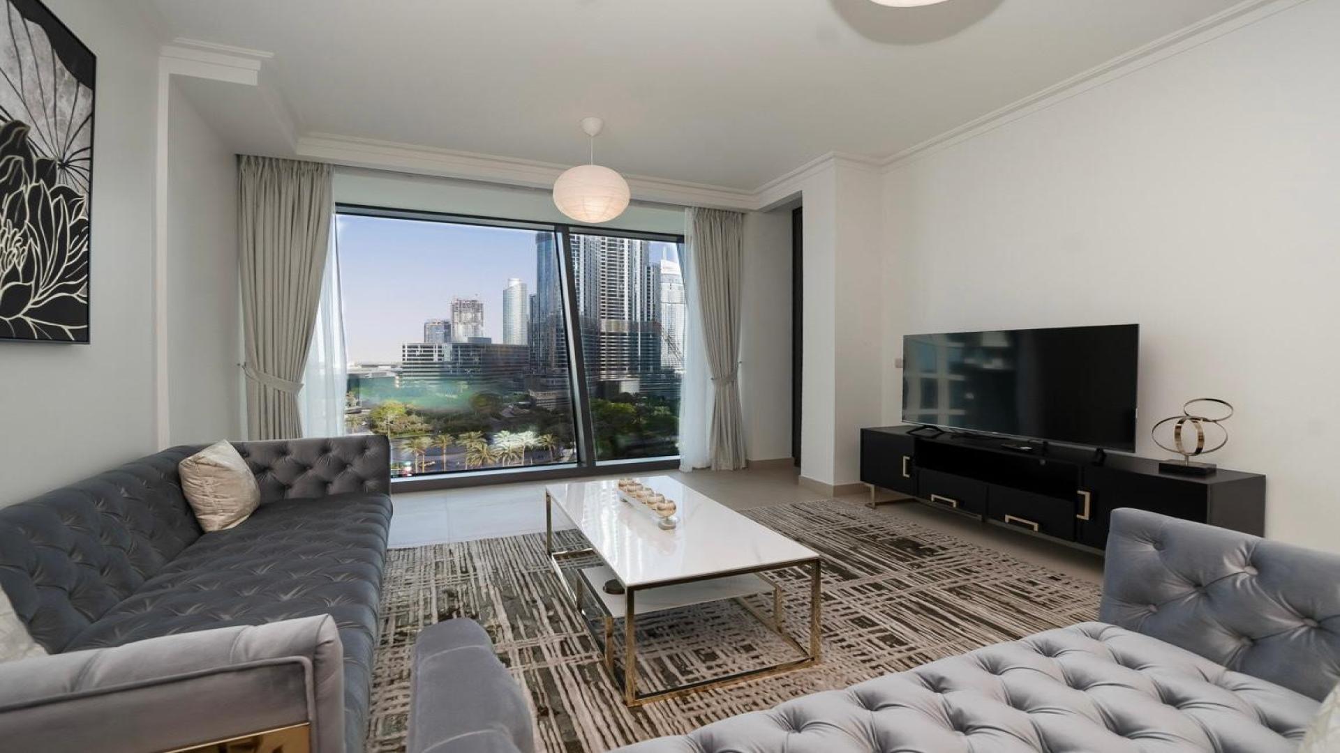 Modern furnished living and dining area in Burj Vista 2 apartment, Downtown Dubai