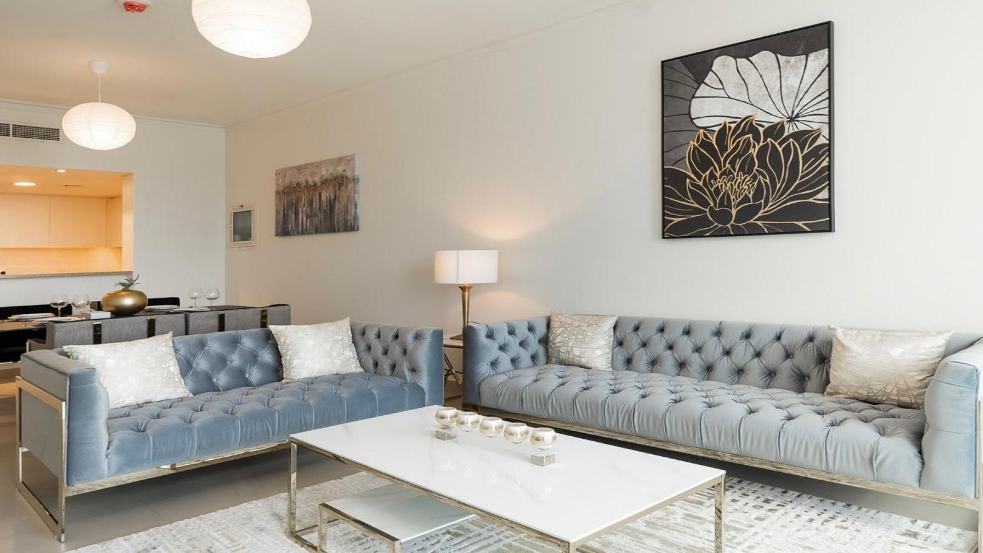 Modern living room in Burj Vista apartment with city view, Downtown Dubai