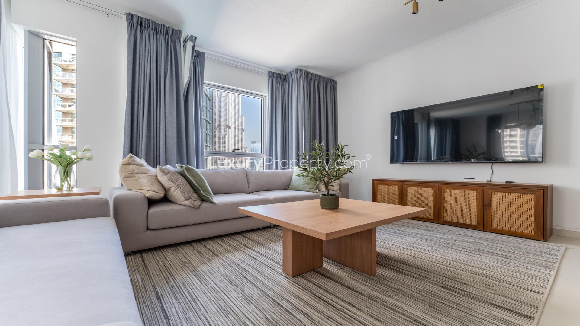 Modern furnished living room in Downtown Dubai apartment with view of Burj Khalifa