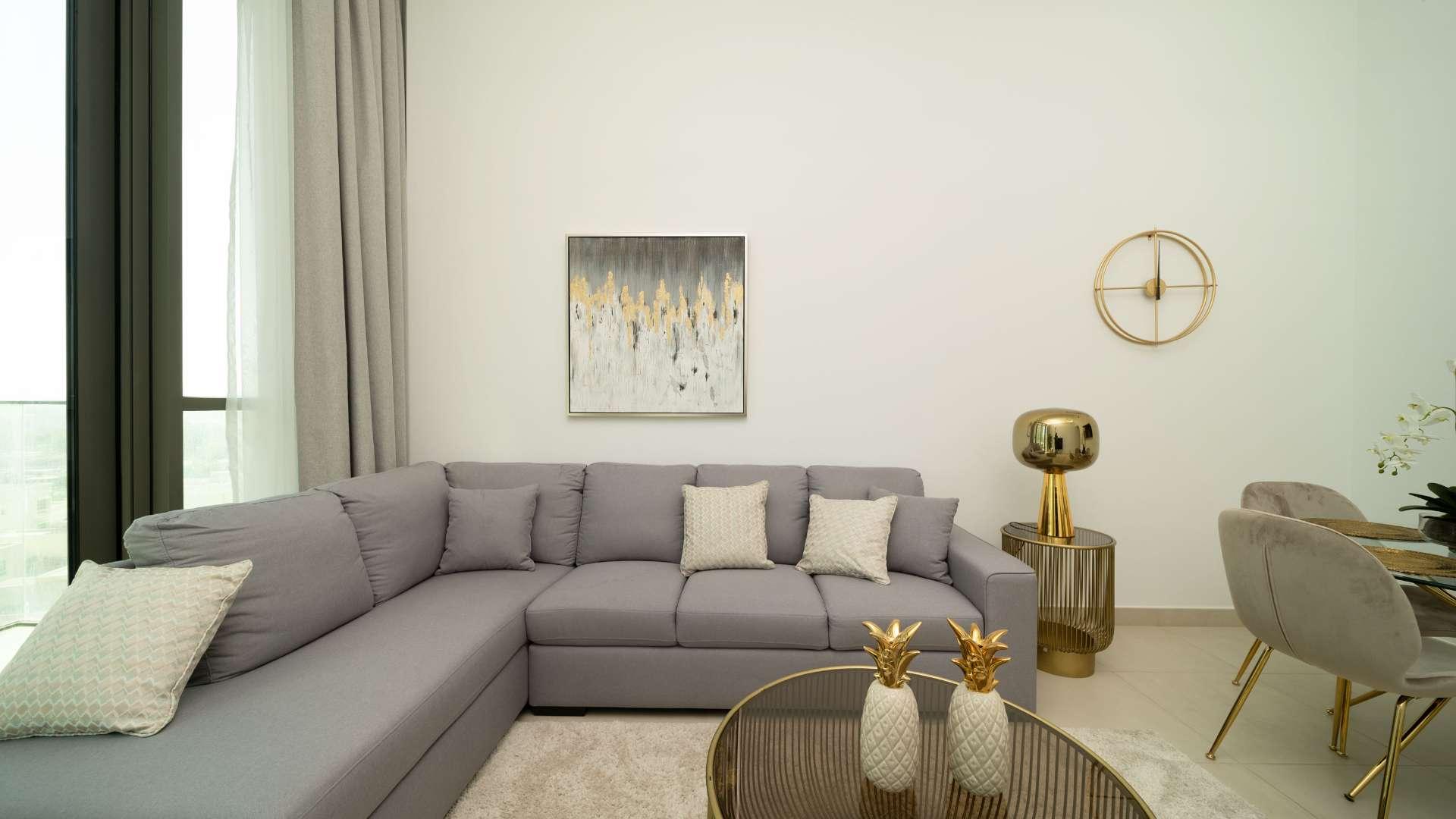 Luxury bedroom in Downtown Dubai apartment with large windows and modern furnishings