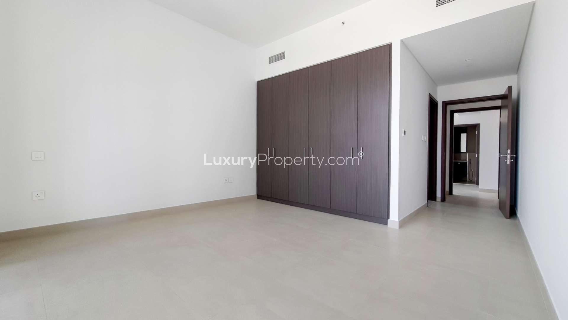 Empty bedroom with built-in wardrobe in Downtown Dubai apartment for rent