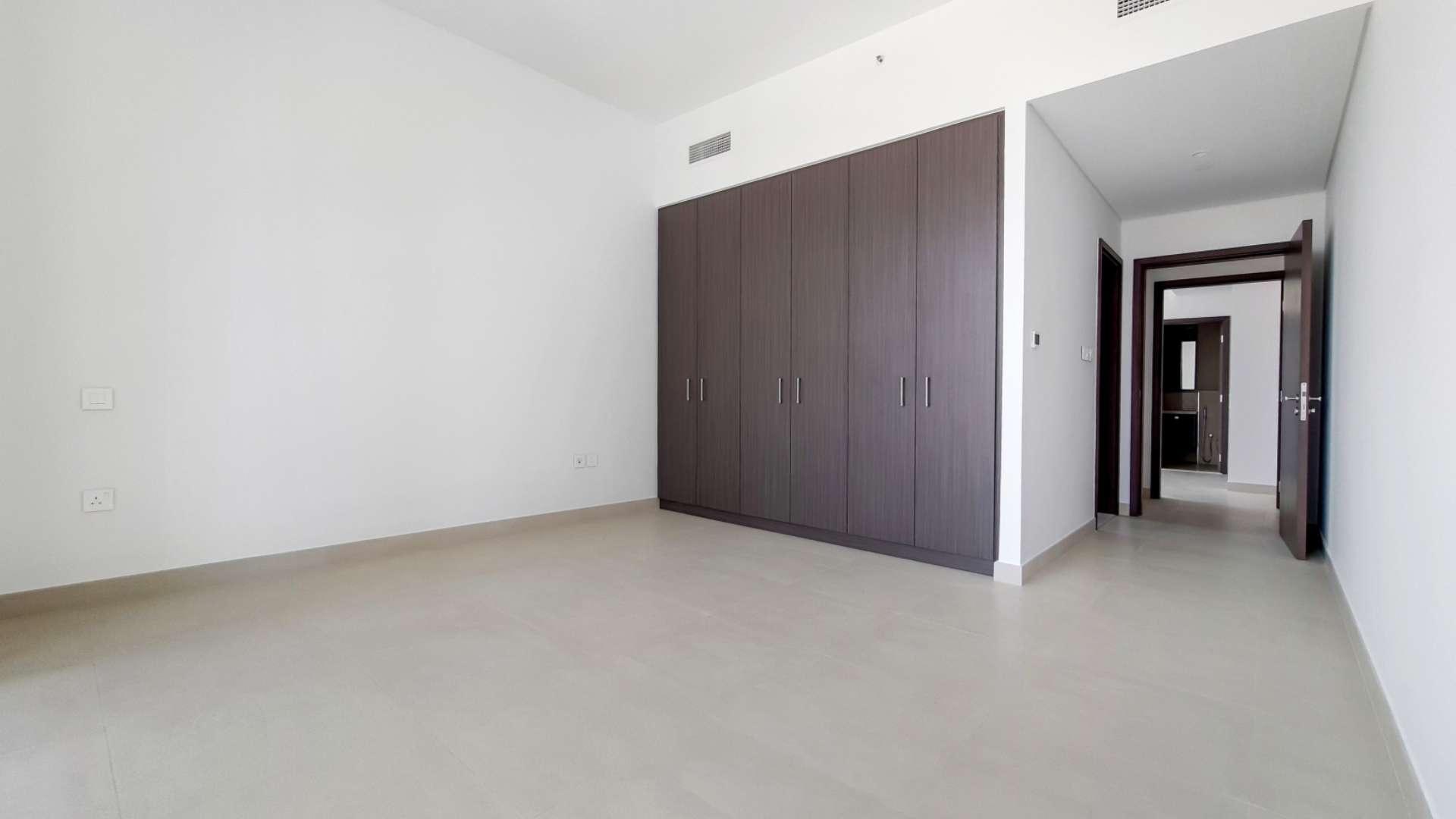 Empty bedroom with built-in wardrobe in Downtown Dubai apartment for rent