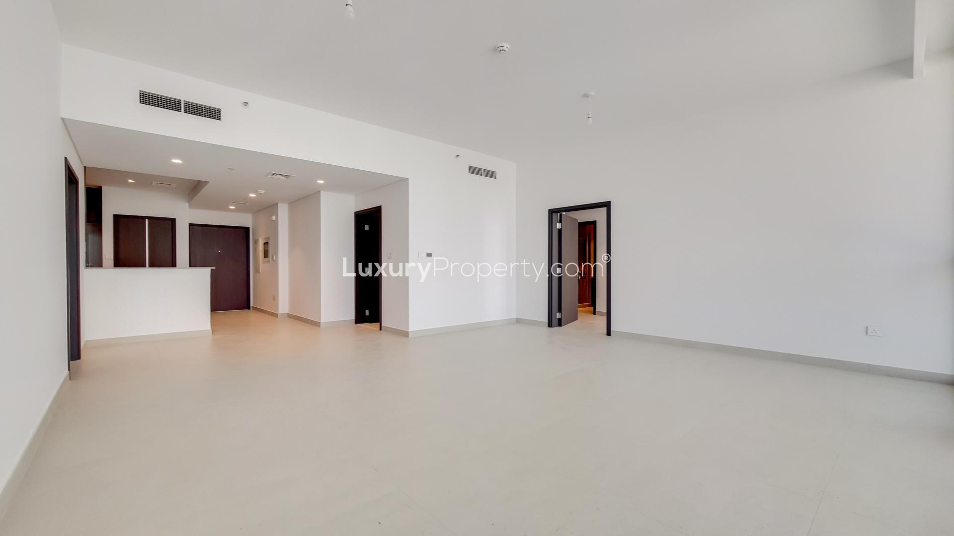 High-floor apartment balcony view in Downtown Views, Dubai, showcasing city skyline and buildings