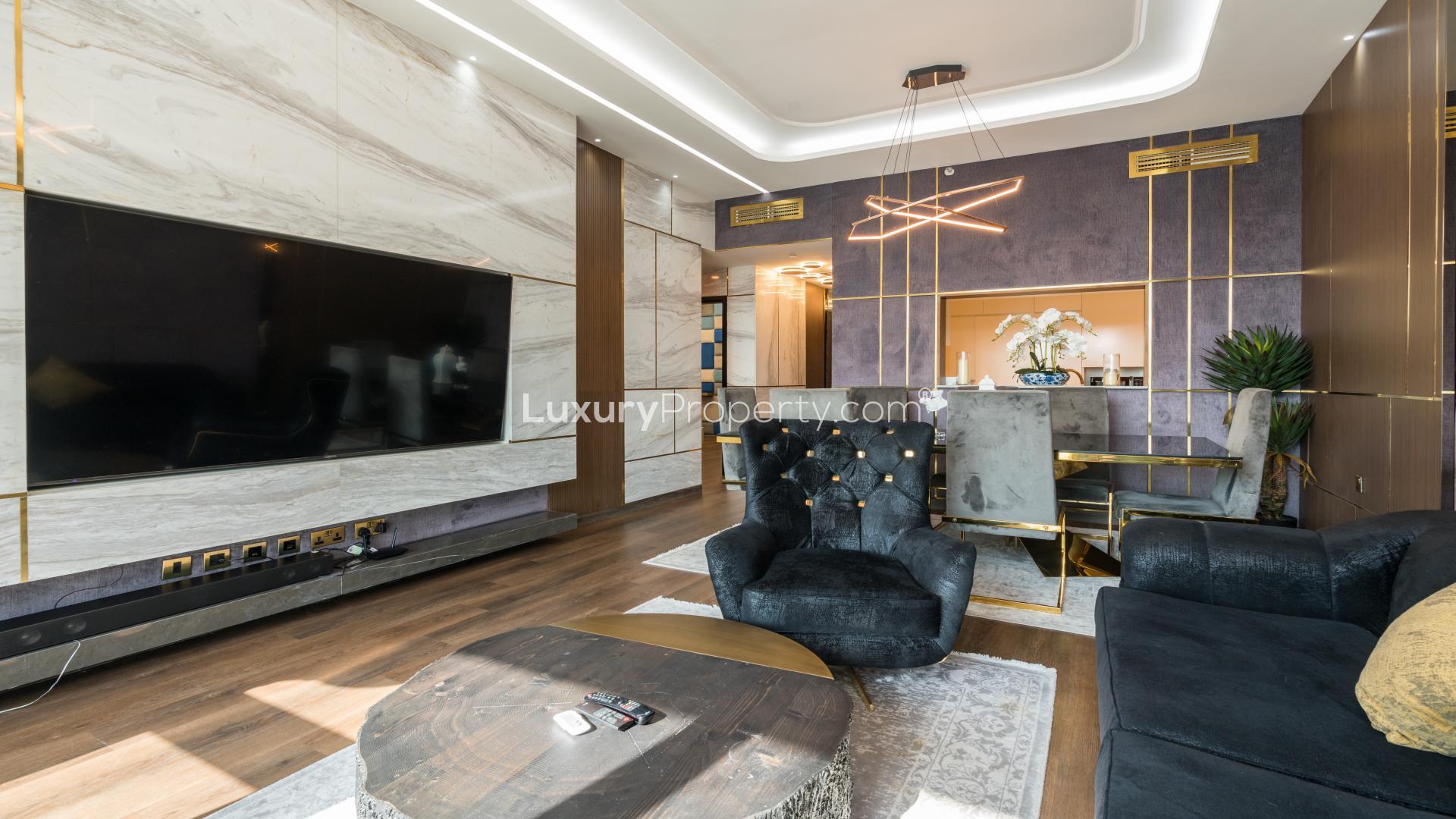 Luxurious furnished living room in Downtown Dubai apartment with modern decor and elegant finishes
