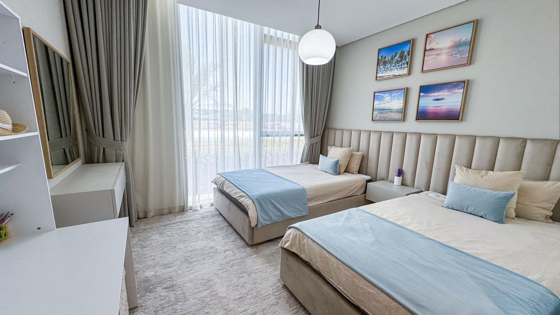 Modern open-plan kitchen and living area in lagoon-access apartment, District One, Mohammed Bin Rashid City