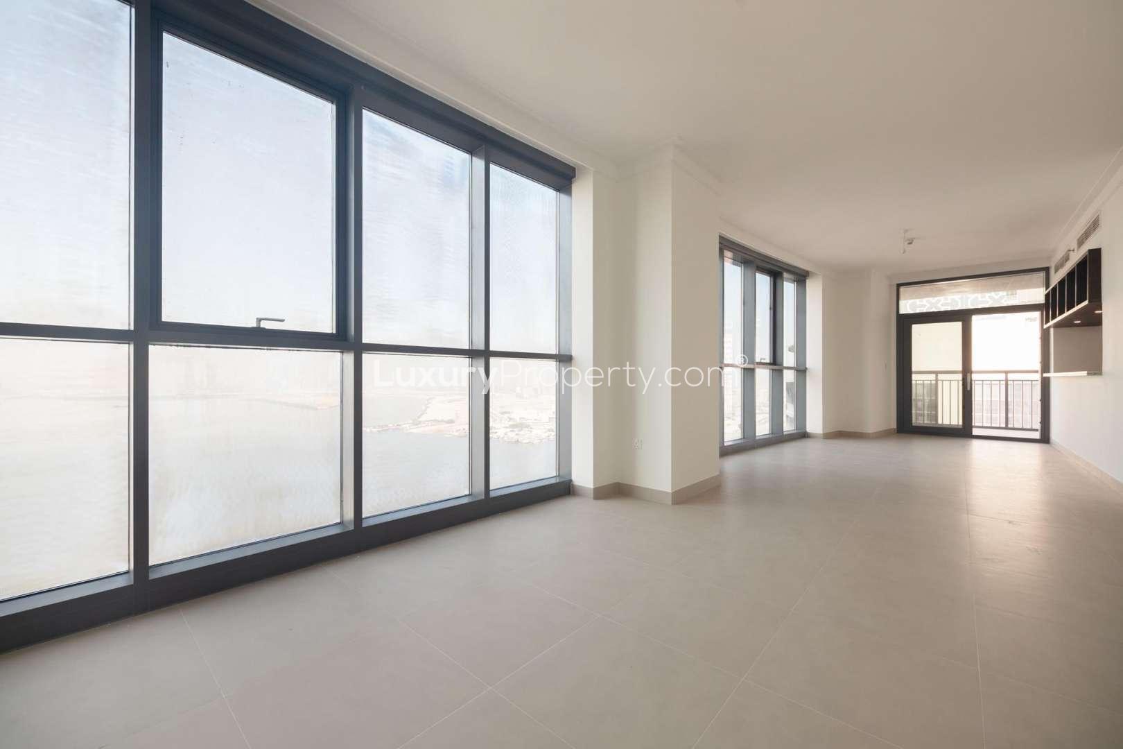 Furnished 2-bed apartment living area with marina views, expansive balcony, Dubai Creek Harbour