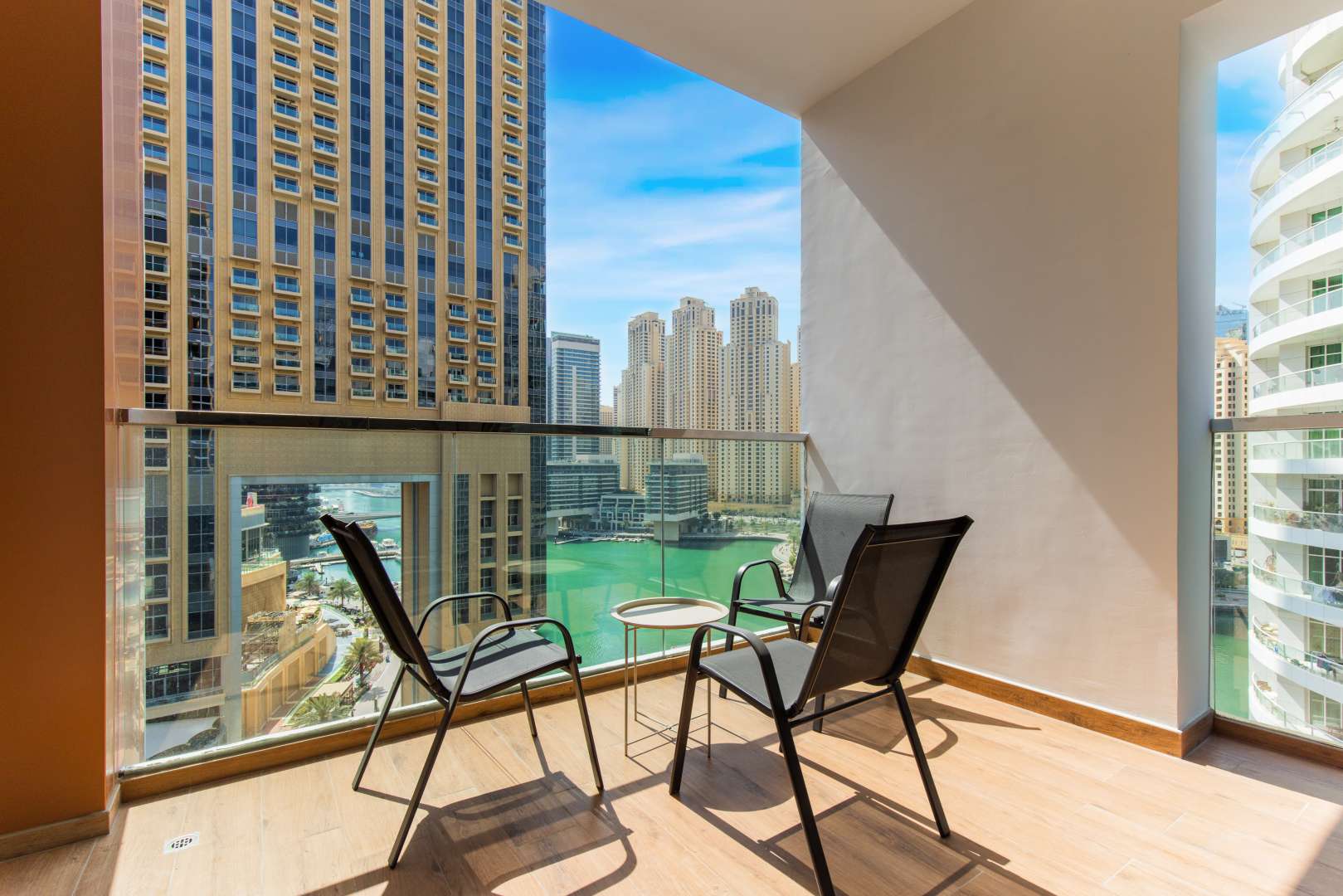 Modern living room in Dubai Marina Moon apartment with stylish furniture and open kitchen