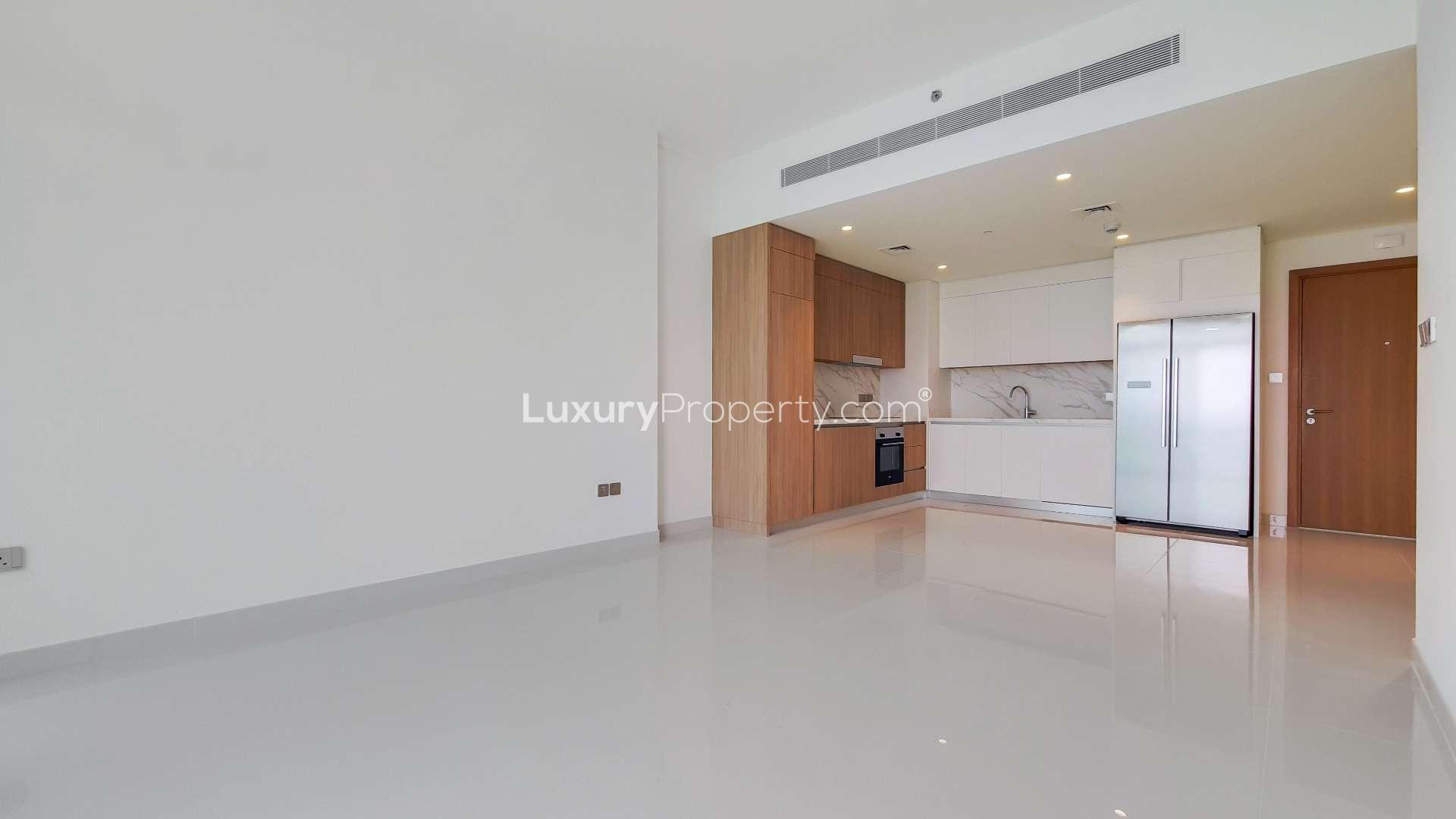 Modern kitchen in Emaar Beachfront apartment, Dubai Harbour, with sleek cabinetry and appliances