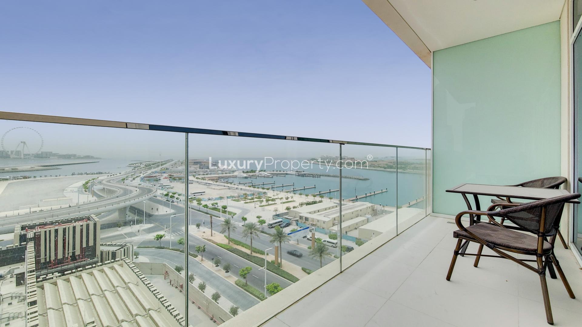 Fully furnished living room with marina view in Emaar Beachfront apartment, Dubai Harbour