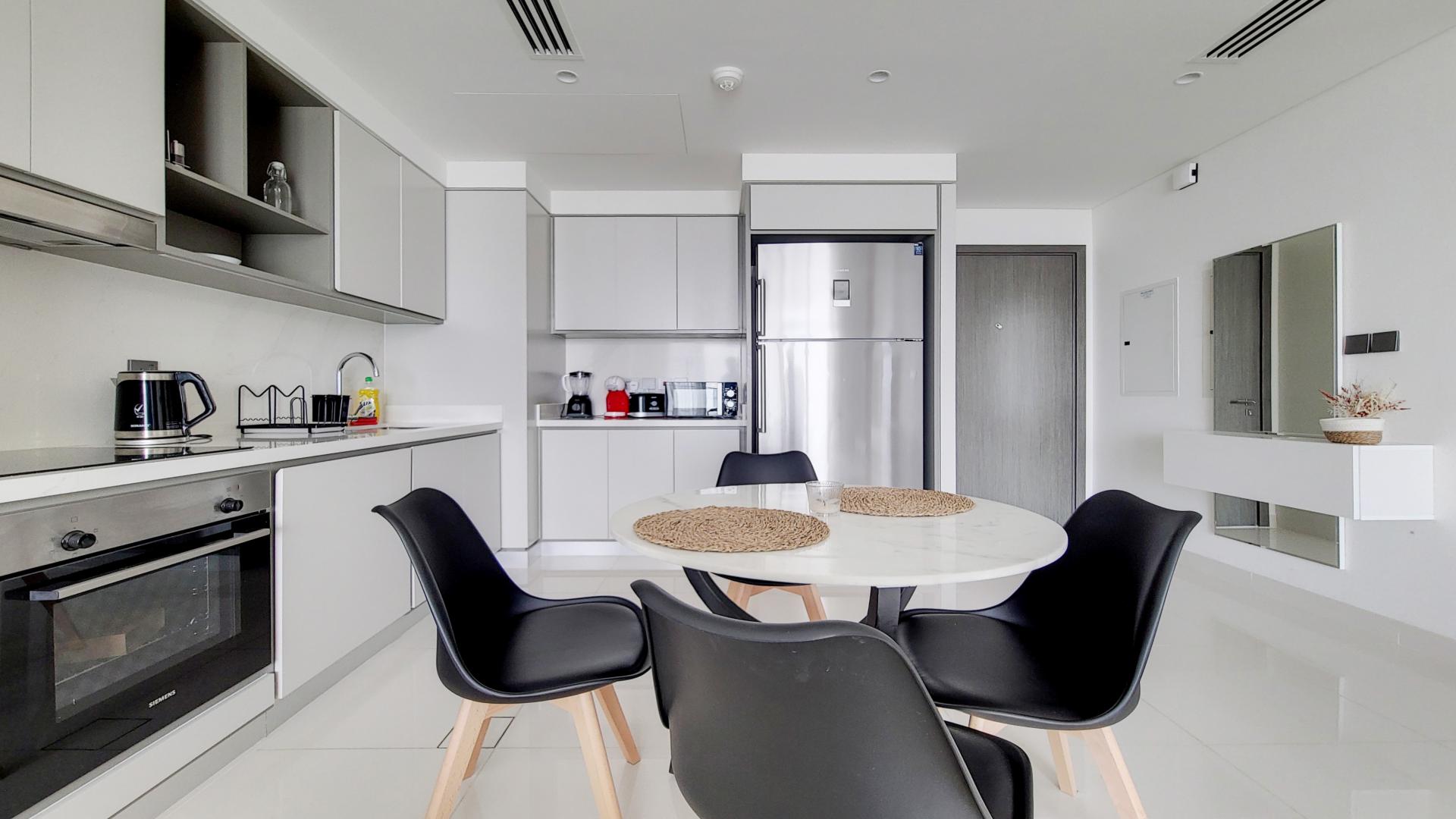 Fully furnished living room in 2-bedroom apartment, Emaar Beachfront, Dubai Harbour, modern decor