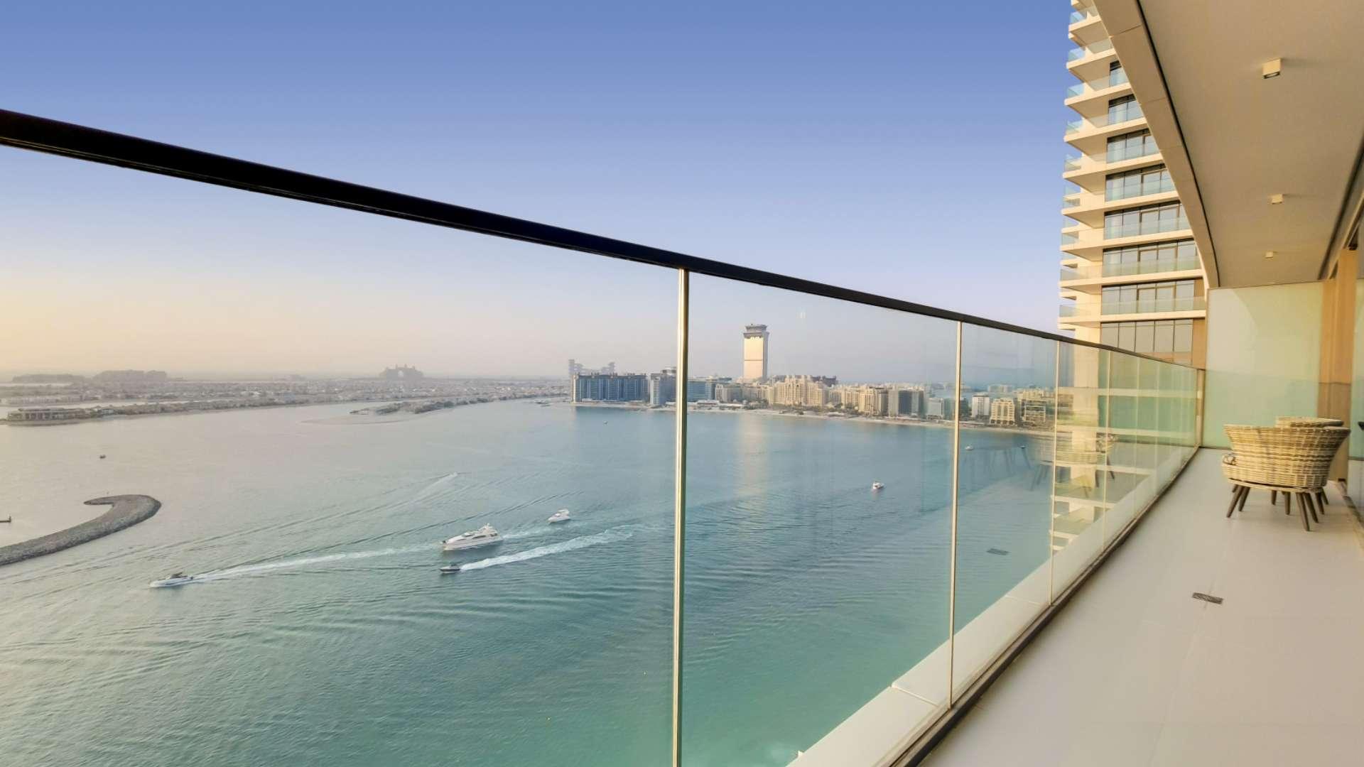 Modern kitchen and dining area in Emaar Beachfront apartment, Dubai Harbour