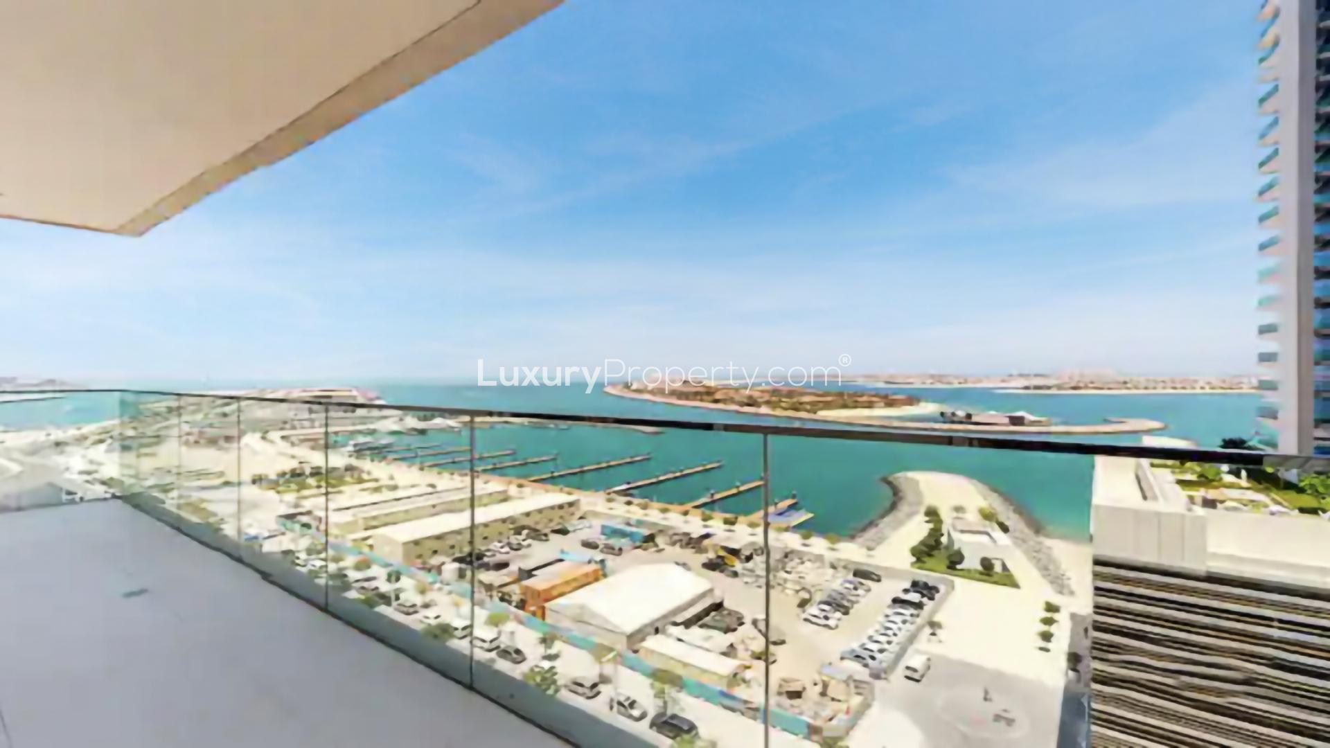 Luxurious apartment balcony with stunning sea and marina views in Emaar Beachfront, Dubai Harbour
