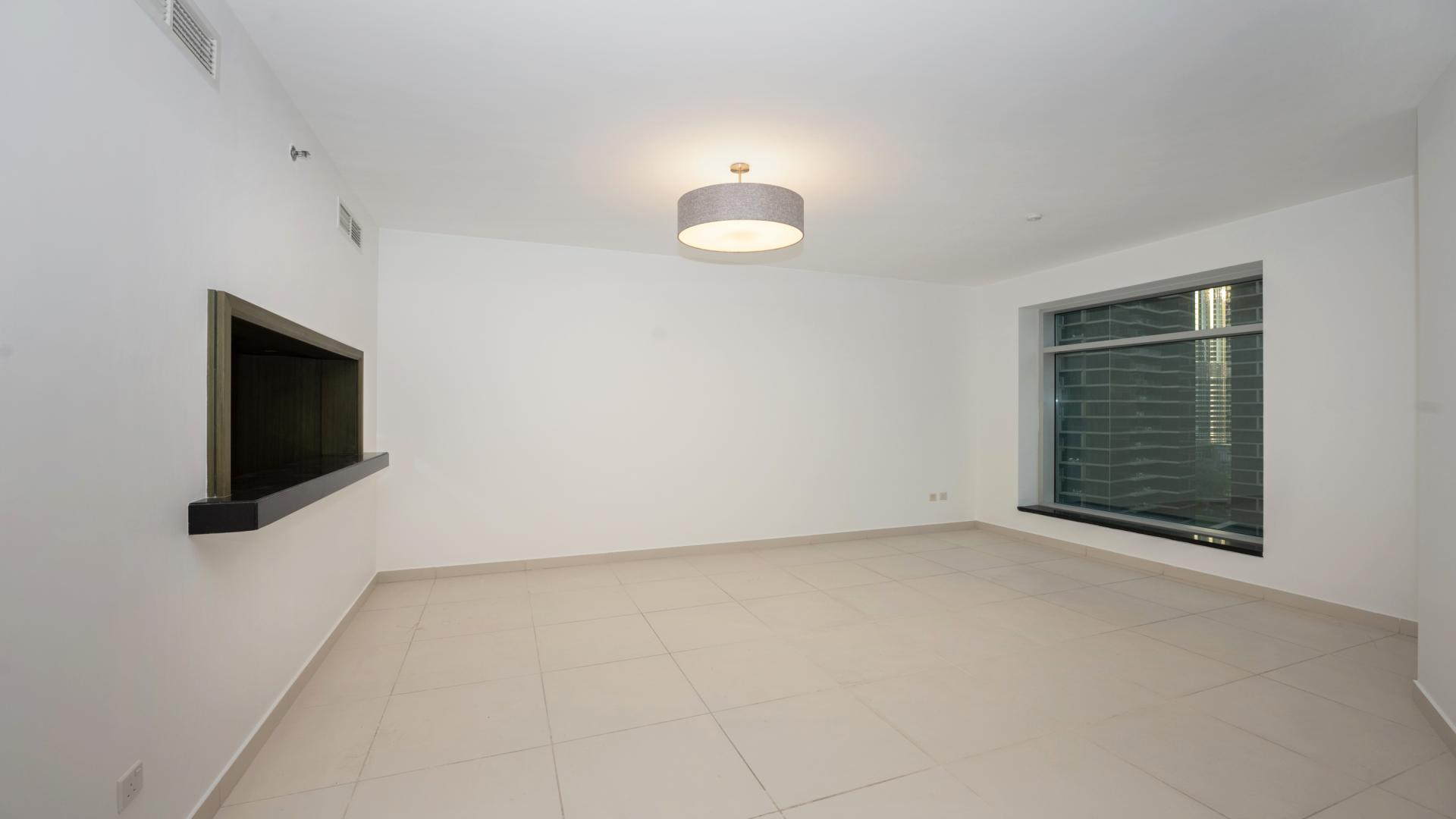 Modern kitchen in spacious Downtown Dubai apartment, The Lofts, with sleek cabinetry and appliances