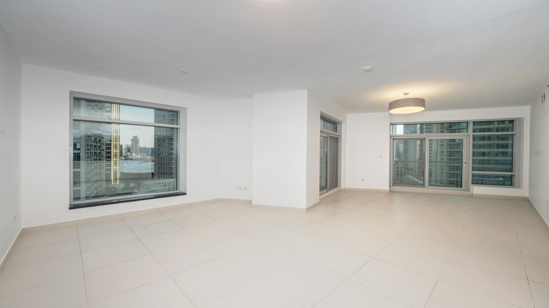 Vacant apartment balcony view of Downtown Dubai skyline, spacious layout, Burj Khalifa visible