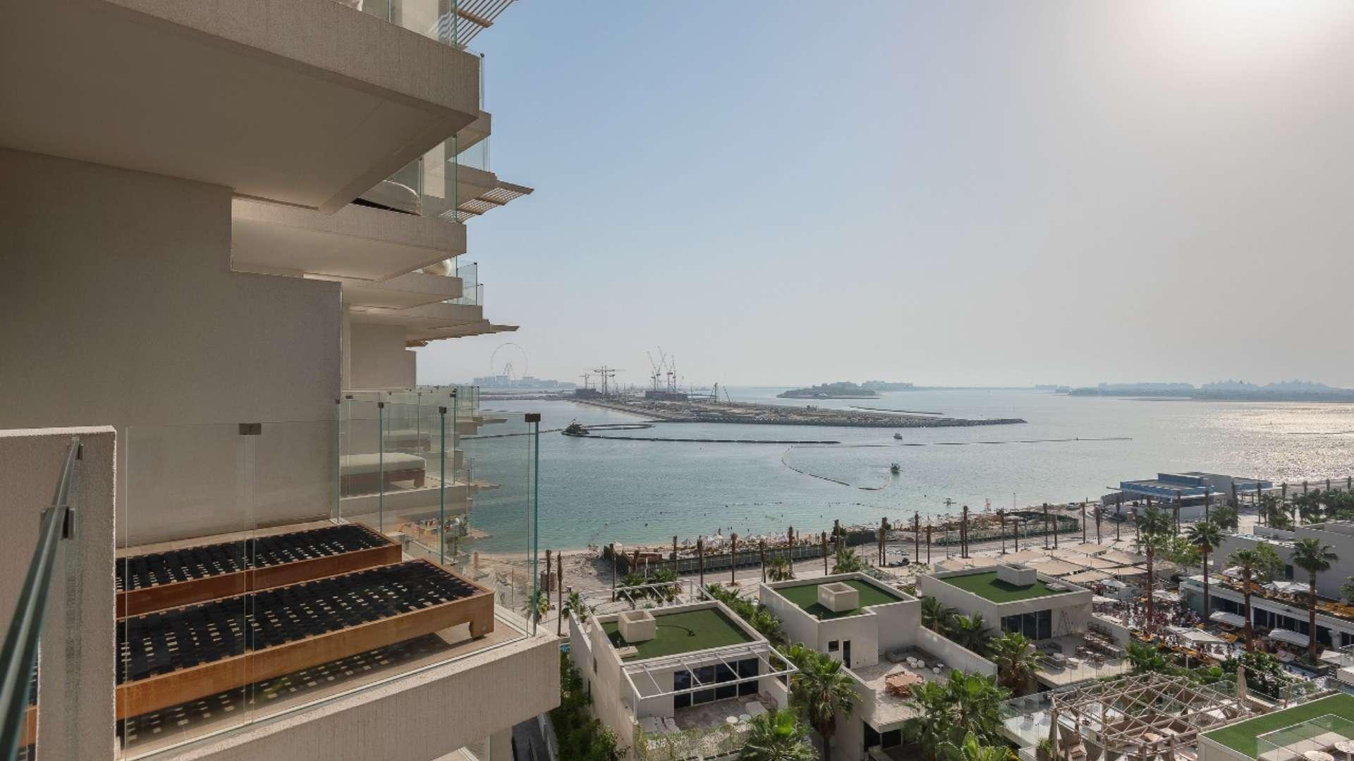 Modern living room in Palm Jumeirah apartment with elegant decor and cozy seating