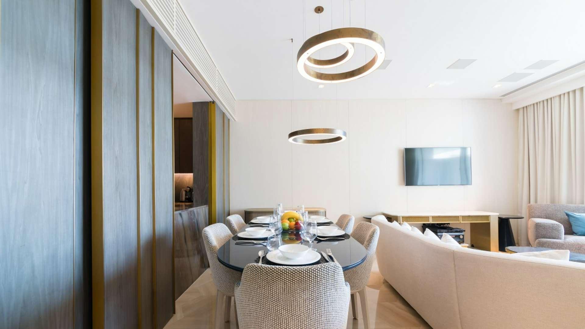 Luxurious furnished living room in Palm Jumeirah apartment with modern decor and amenities