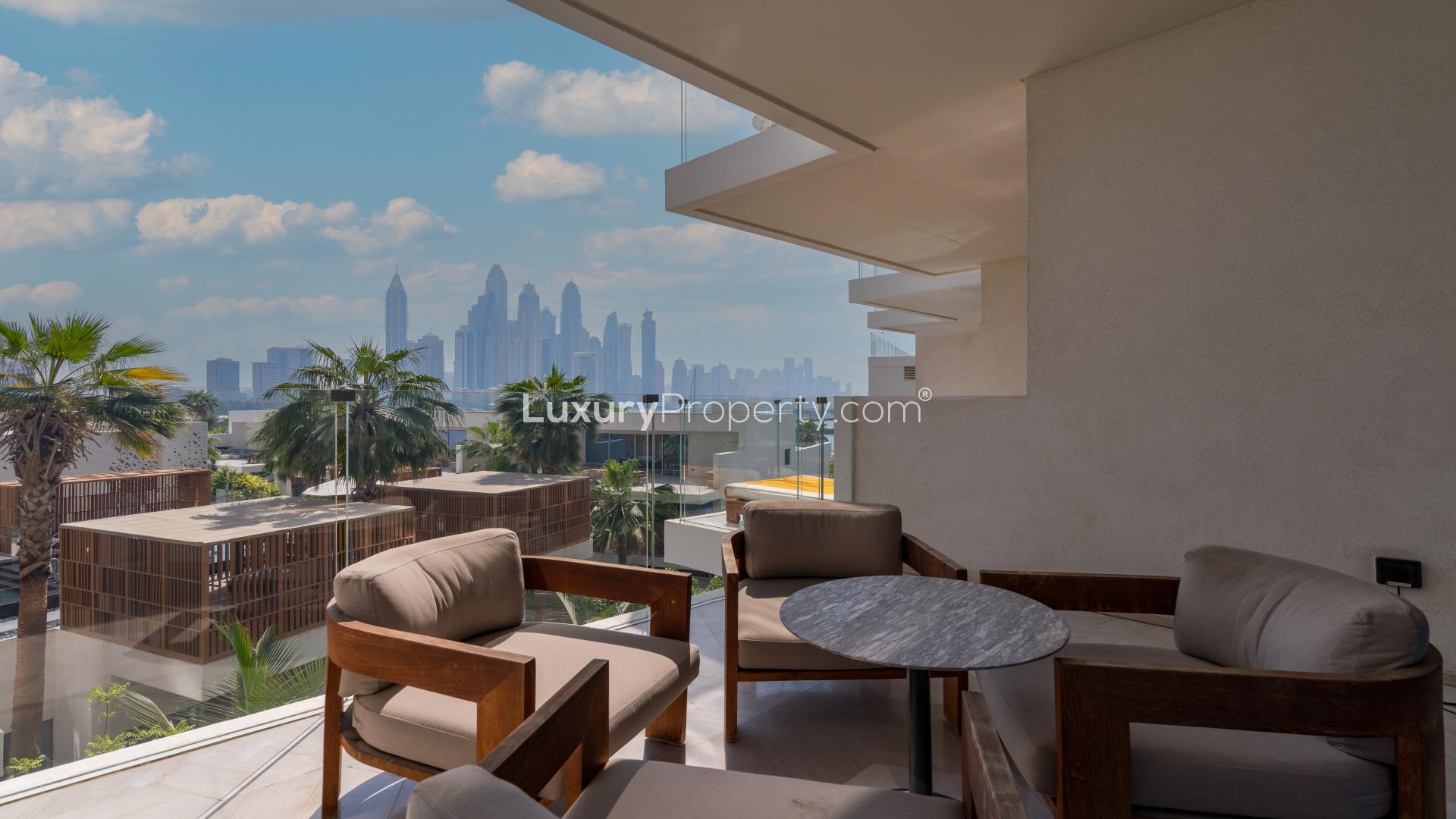 Fully furnished living and dining area in Palm Jumeirah apartment with stunning views