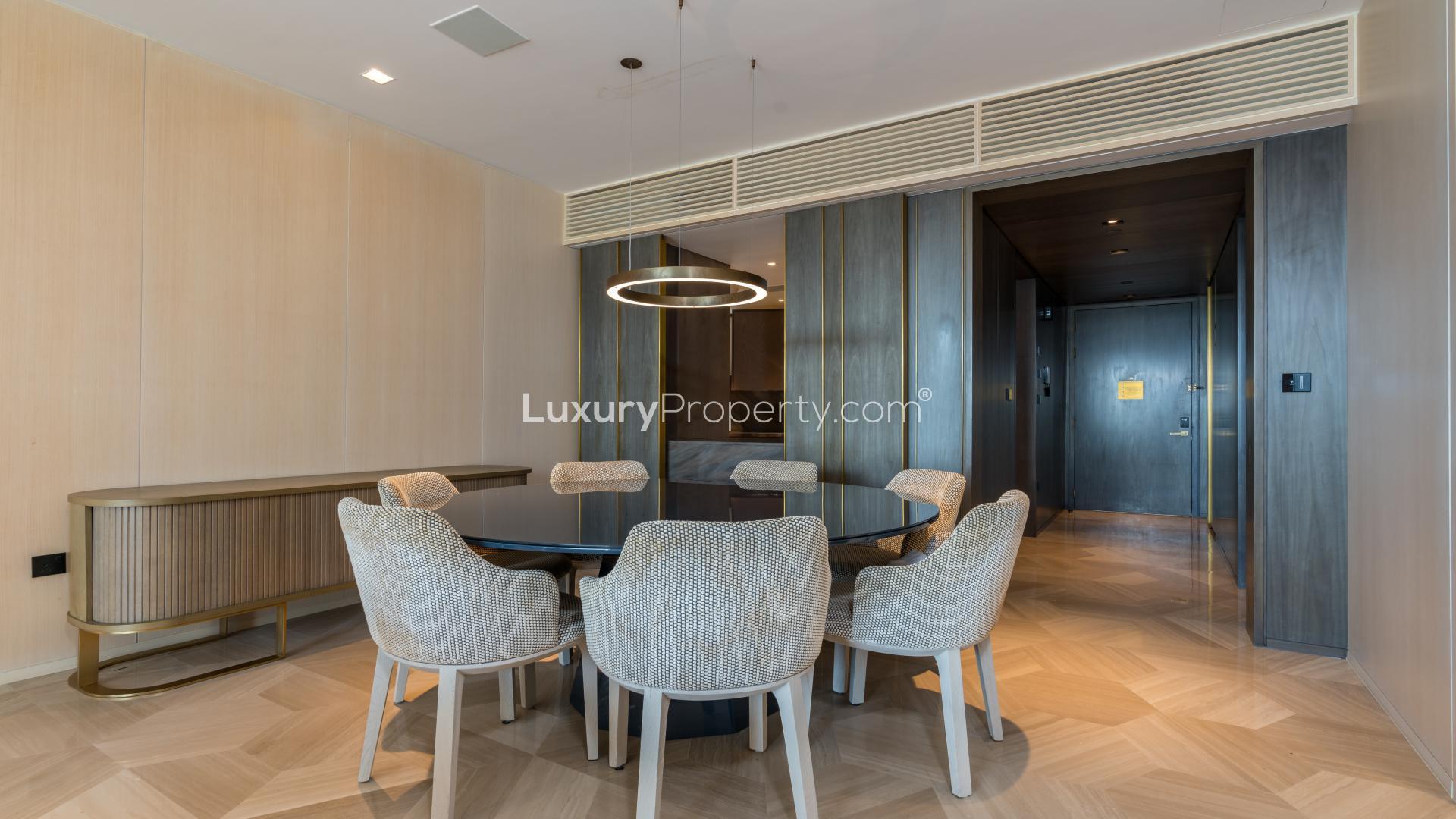 "Palm Jumeirah apartment balcony with skyline views, fully furnished for rent at FIVE Palm.",Dining area in fully furnished Palm Jumeirah apartment for rent, featuring modern decor