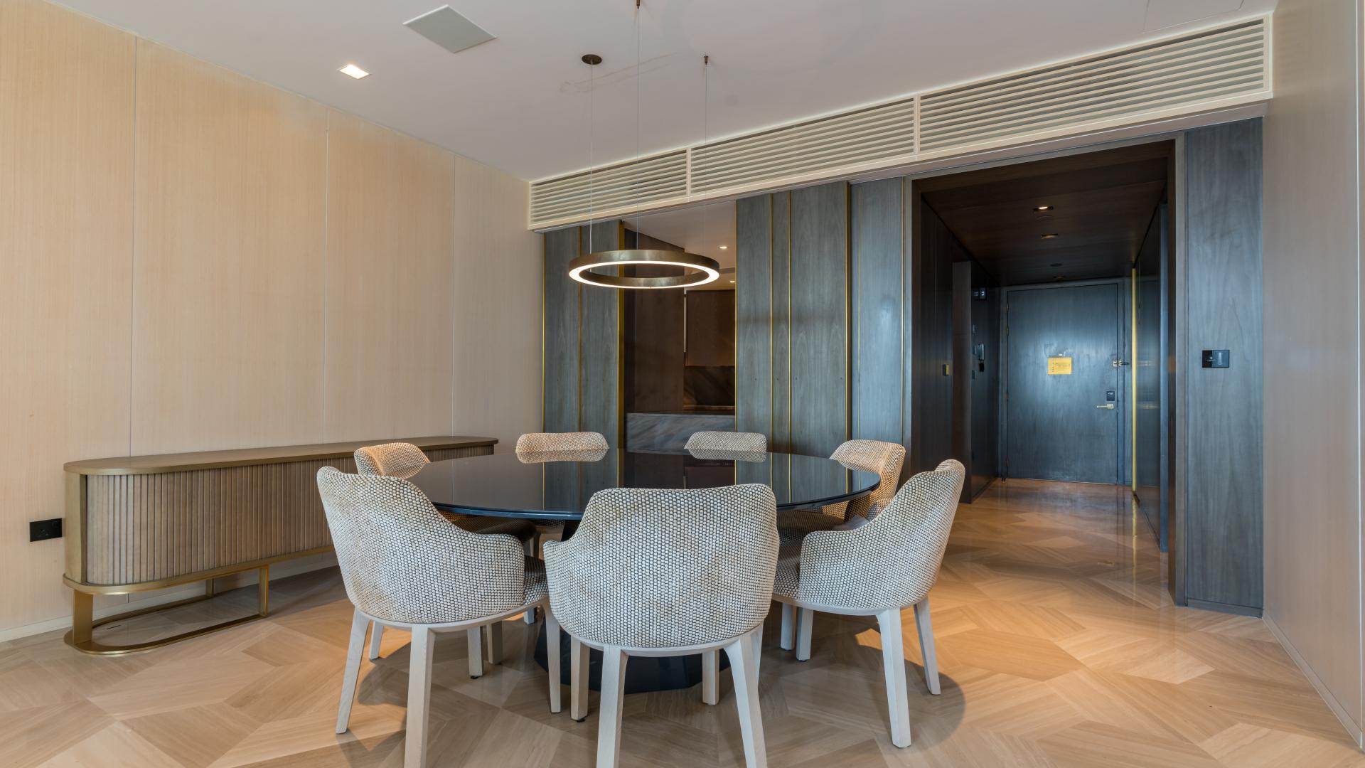 "Palm Jumeirah apartment balcony with skyline views, fully furnished for rent at FIVE Palm.",Dining area in fully furnished Palm Jumeirah apartment for rent, featuring modern decor