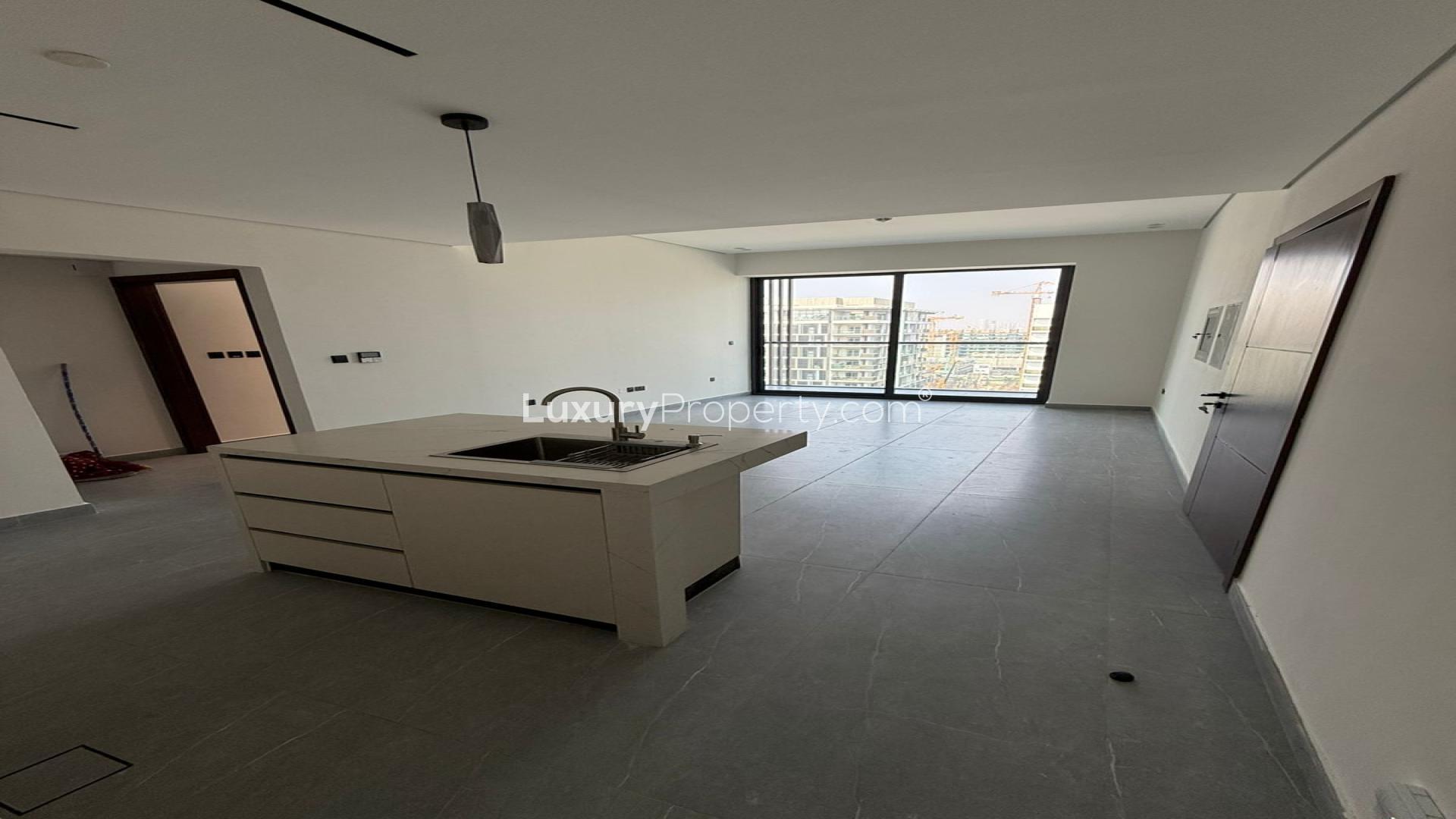 Brand new 2-bedroom apartment interior with modern kitchen, large windows in Jumeirah Garden City