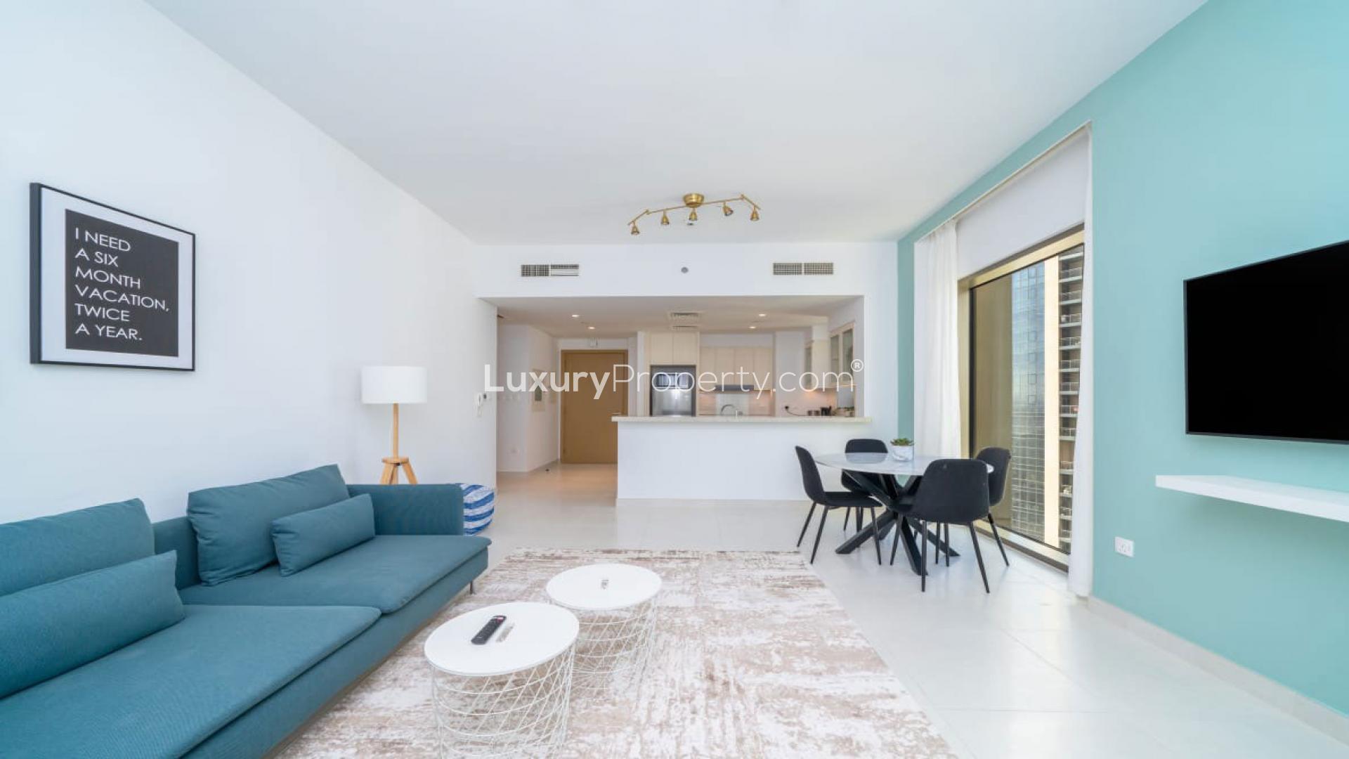 Modern living room in Creekside 18 apartment, Dubai Creek Harbour, with balcony view