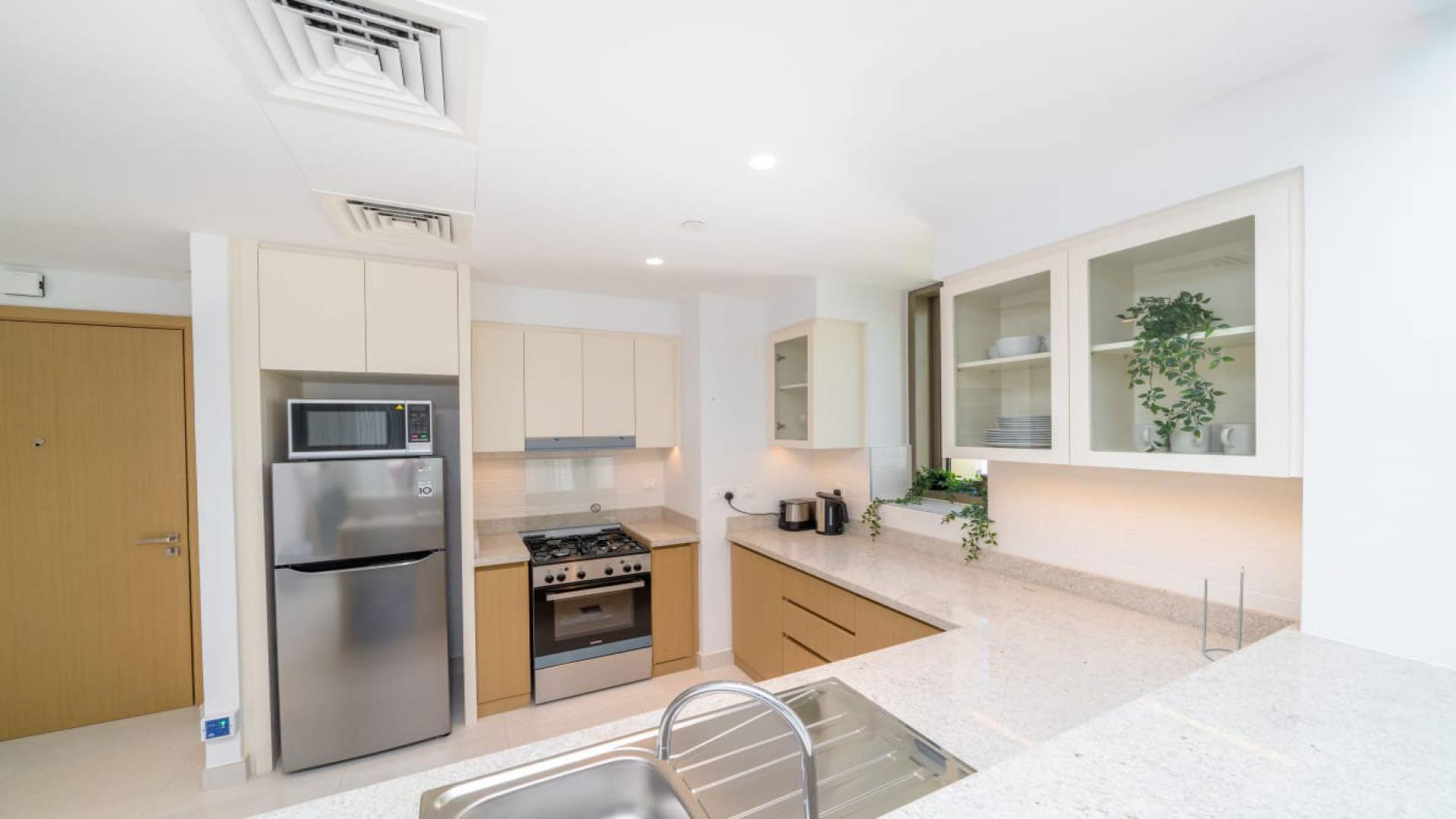 Bright open-plan kitchen and living area in Creekside 18, Dubai Creek Harbour apartment