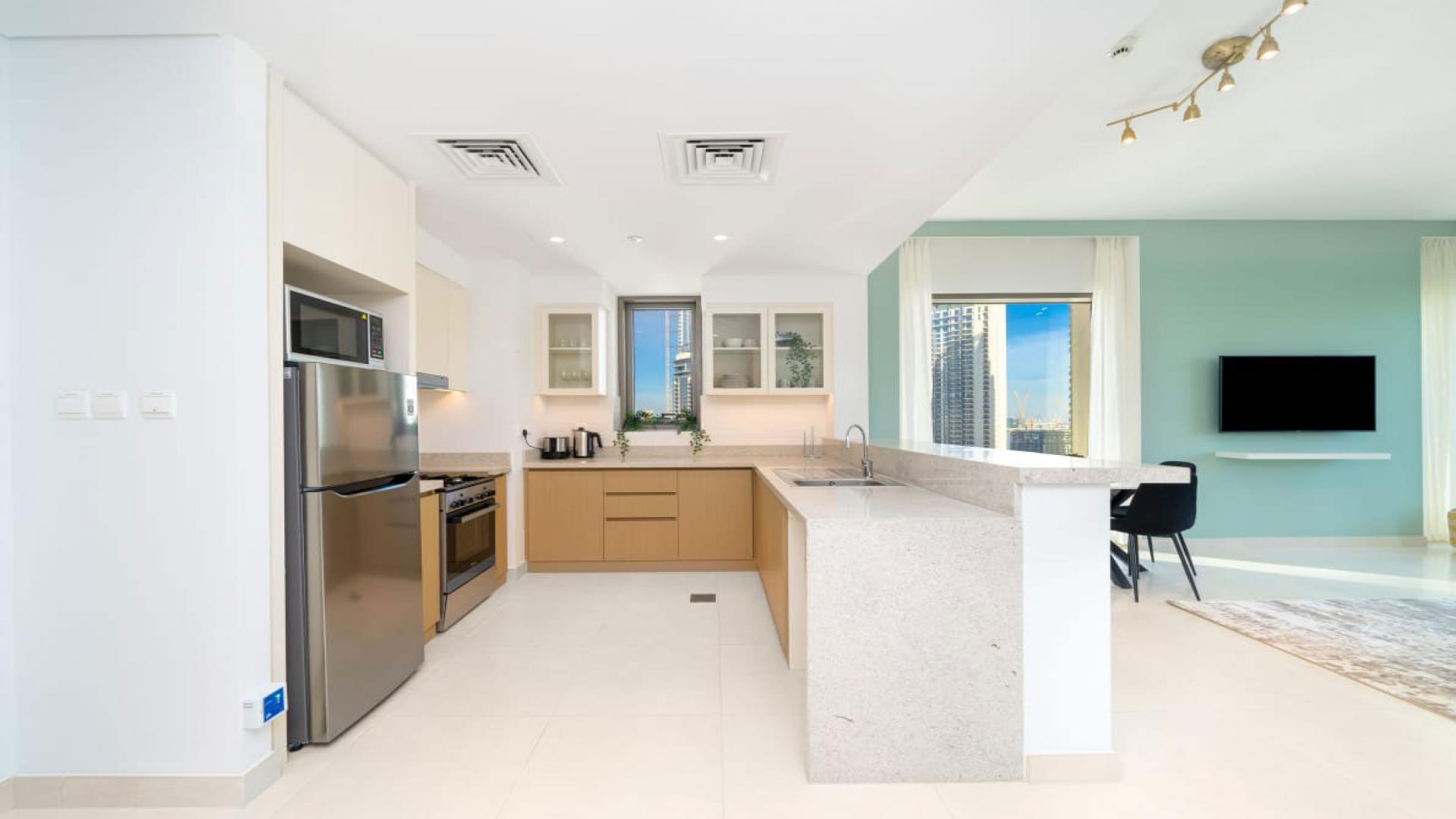 Modern living room in Creekside 18 apartment, Dubai Creek Harbour, with stylish decor and furnishings