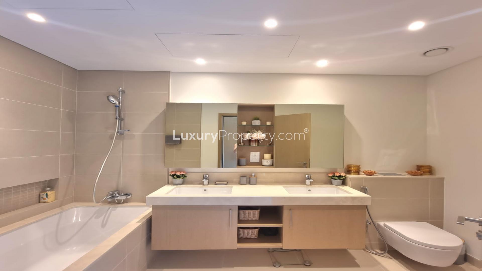 Modern kitchen in 2-bedroom Dubai Marina apartment, featuring sleek cabinetry and stainless appliances