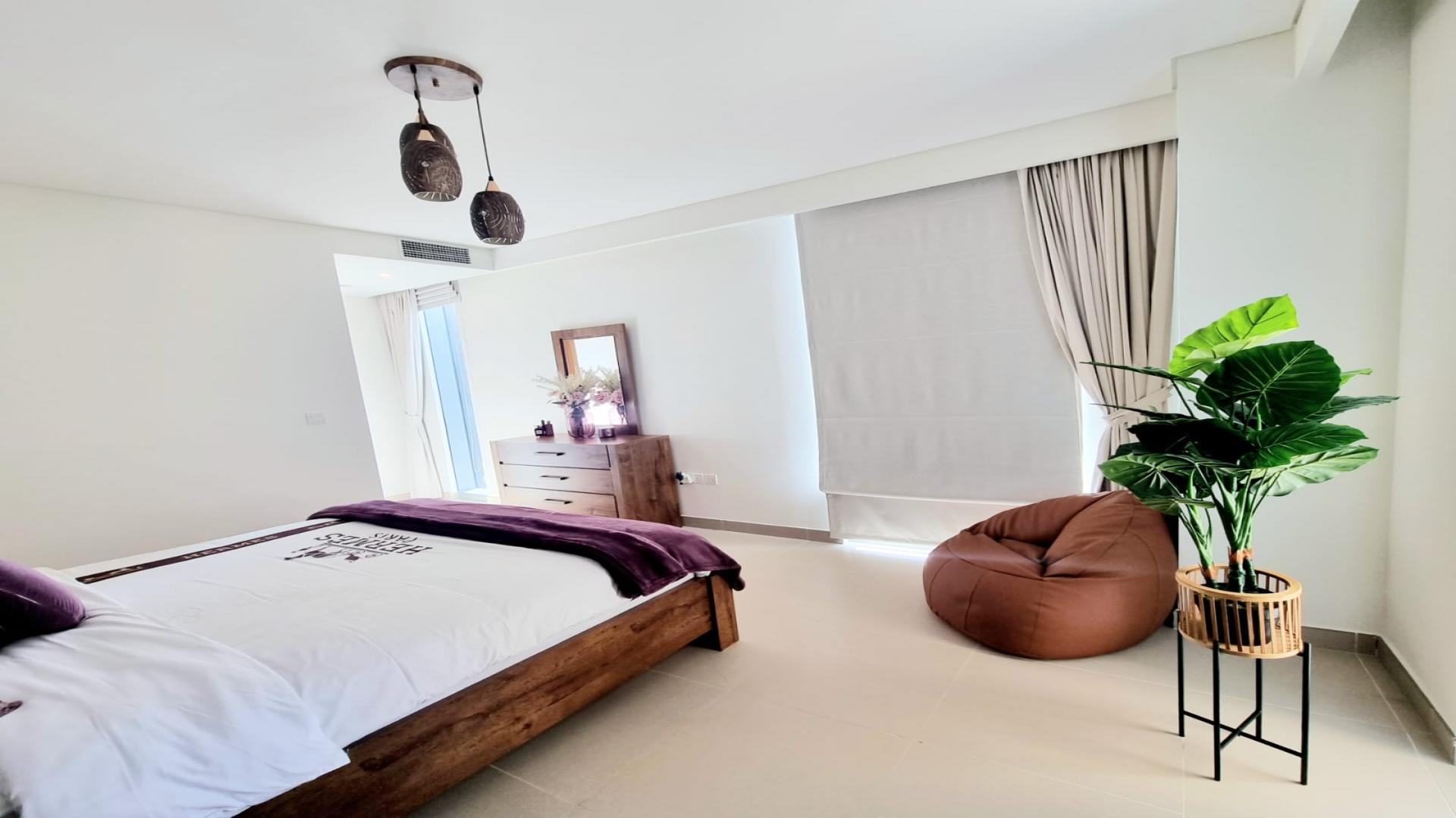 Modern bathroom in 2-bedroom Dubai Marina apartment, featuring double sinks and elegant fixtures