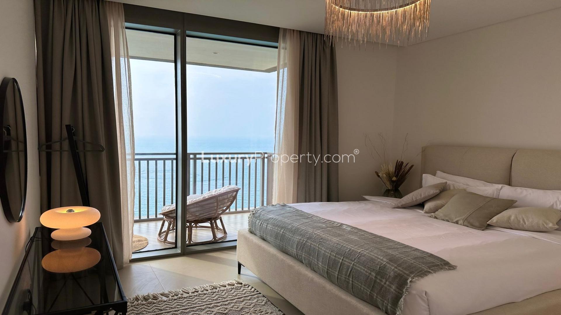Modern Dubai Marina apartment with open-plan living area and waterfront view from balcony