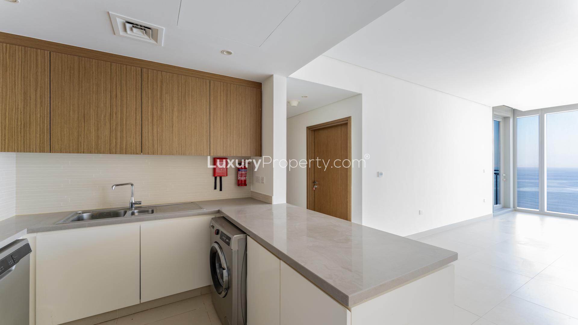 "Stunning sea view from luxurious 2-bed apartment for rent in Dubai Marina, 5242.",Luxurious Dubai Marina apartment kitchen with sea views, modern design, and ample natural light