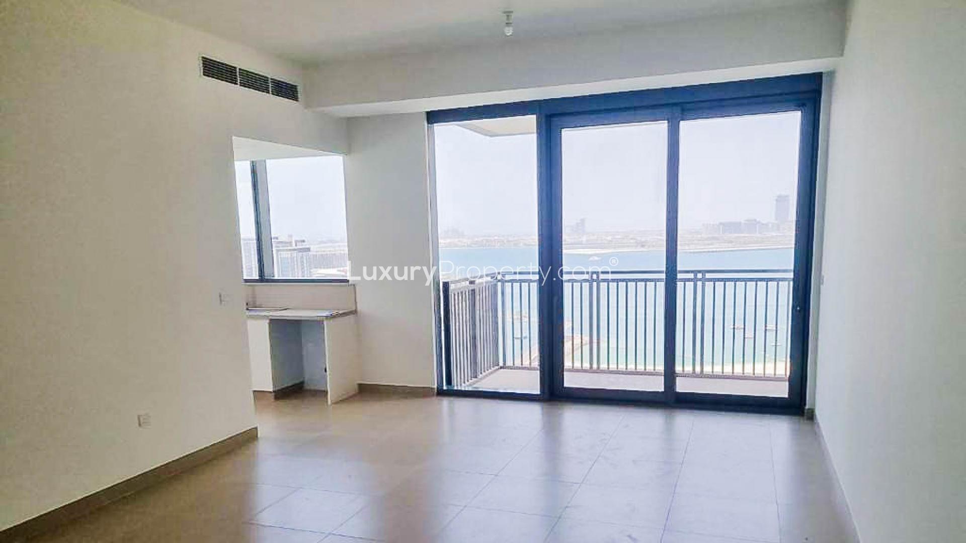 "Scenic Dubai Marina view from 2-bedroom apartment, 5242 sub-community, waterfront and cityscape.",Empty living room with large windows and balcony view in Dubai Marina apartment