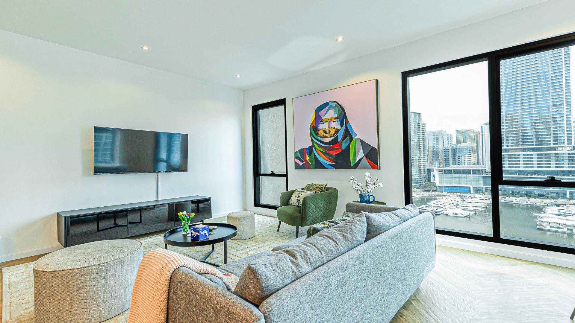 Modern living area in luxury 2-bed apartment, Dubai Marina, with open kitchen and decor
