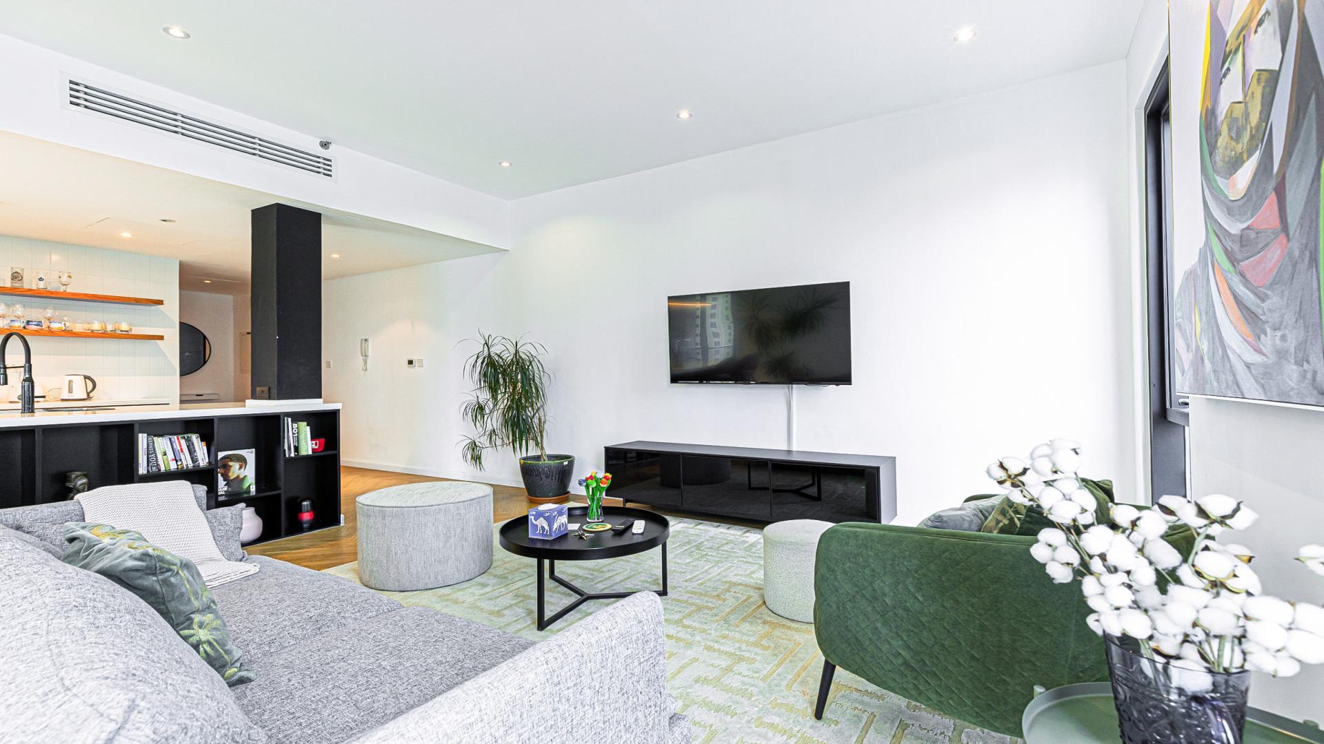 Dubai Marina Promenade apartment exterior with pool, high-rise buildings, and waterfront view