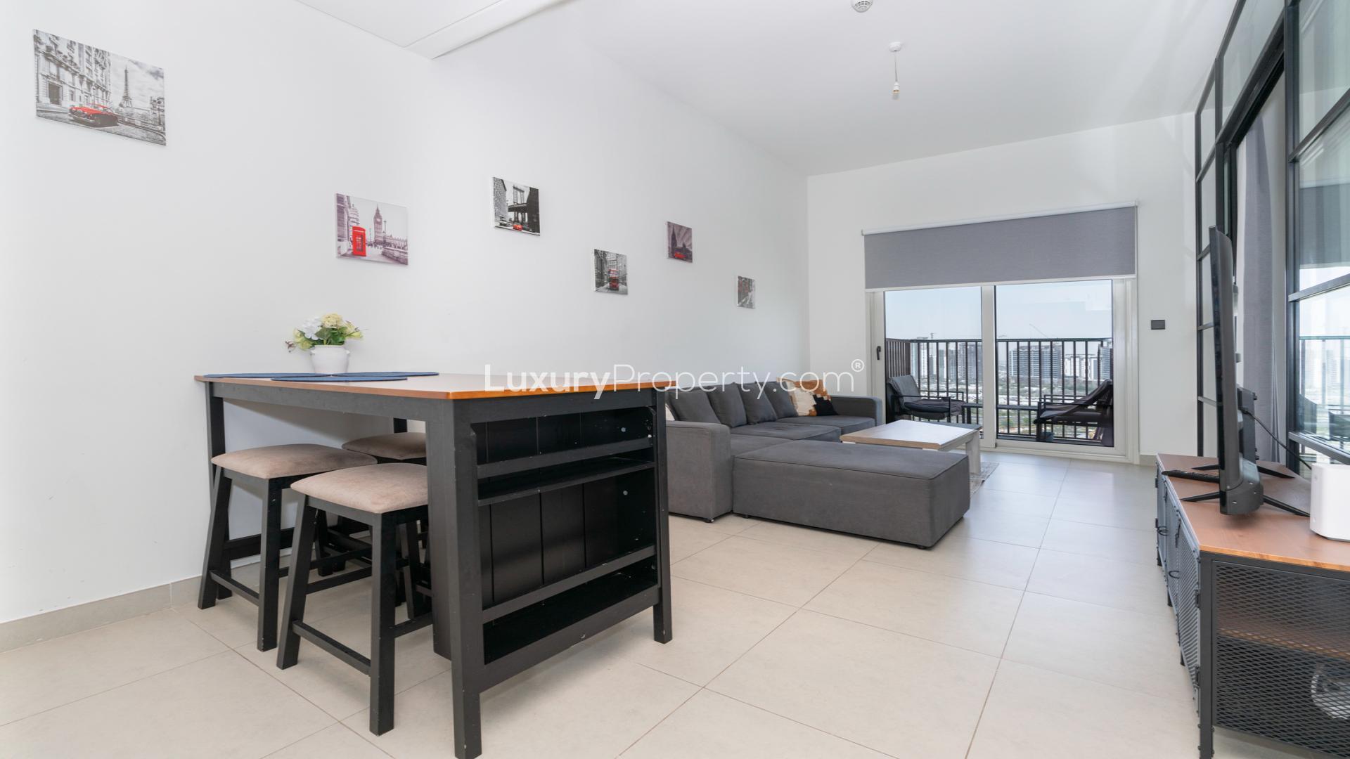 "Furnished apartment interior, open-plan kitchen, living area, Dubai Hills Estate, Collective 2.0.","Furnished living room with balcony view, Dubai Hills Estate apartment for rent, Collective 2.0.",Furnished kitchen in Dubai Hills Estate apartment for rent, featuring modern appliances and dining area